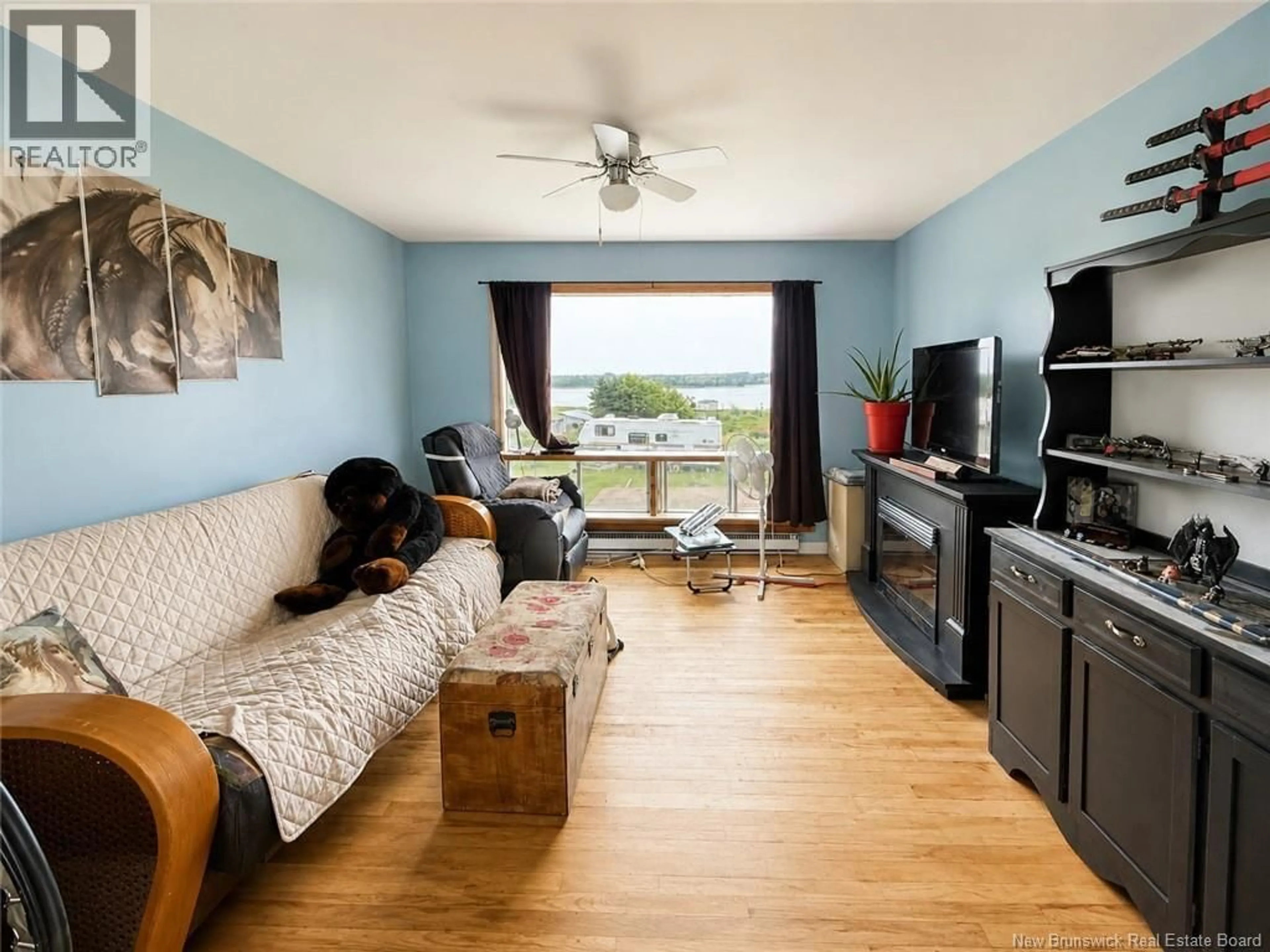 Living room with furniture, wood/laminate floor for 782 ROUTE 535, Cocagne New Brunswick E4R3G6