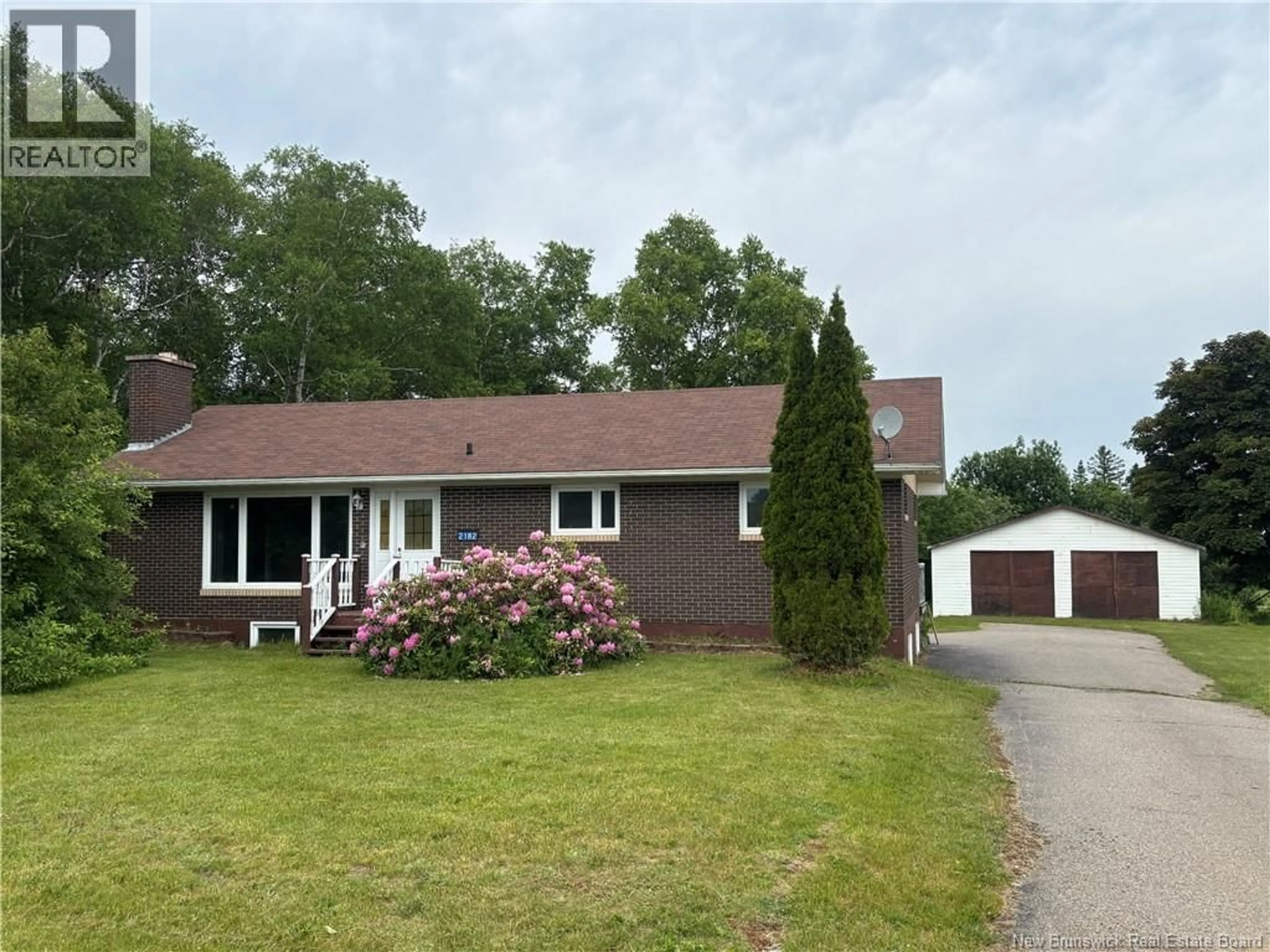Home with vinyl exterior material, street for 2182 MAIN STREET, Belledune New Brunswick E8G2M4