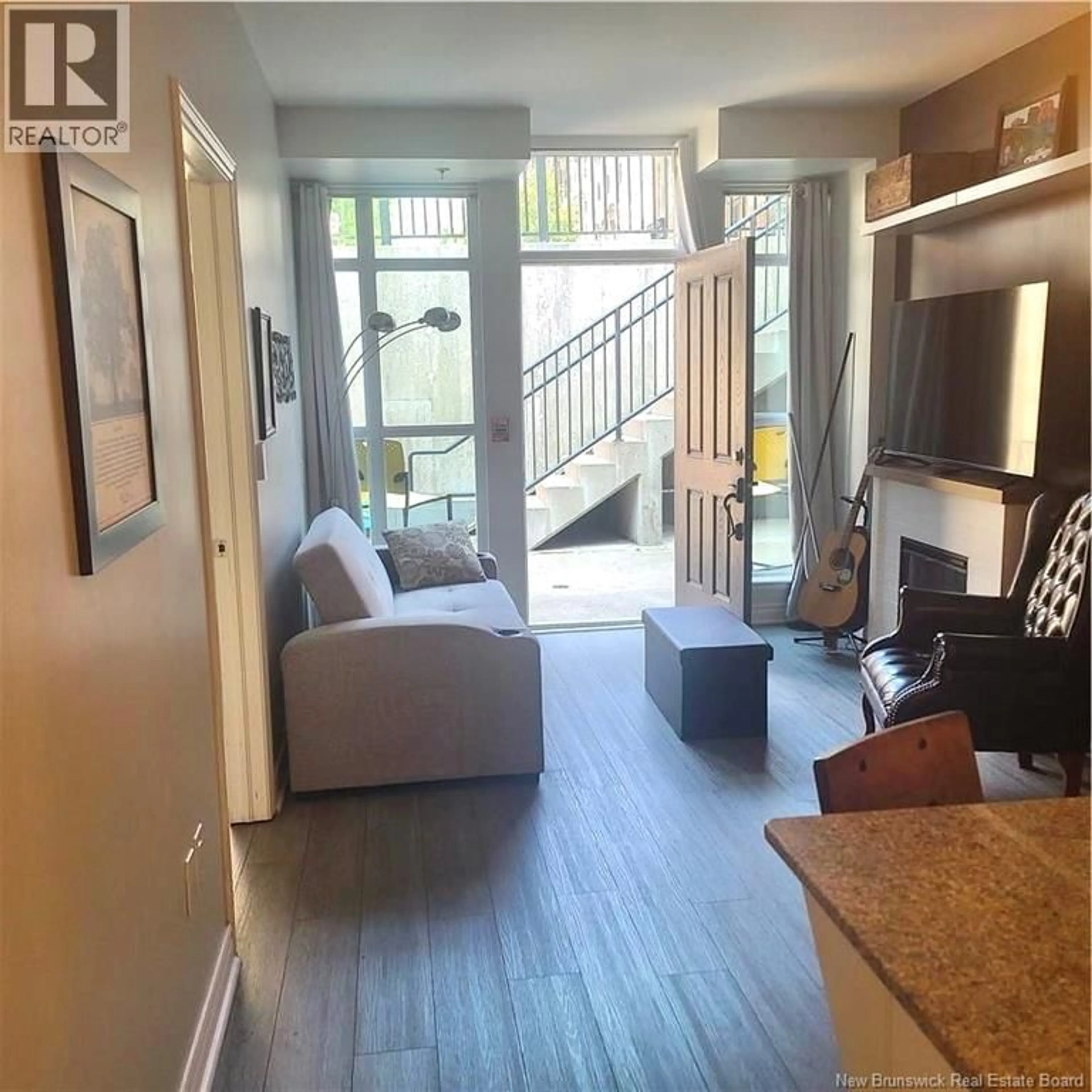 Living room with furniture, wood/laminate floor for 120 - 243 PRINCE WILLIAM STREET, Saint John New Brunswick E2L0C6