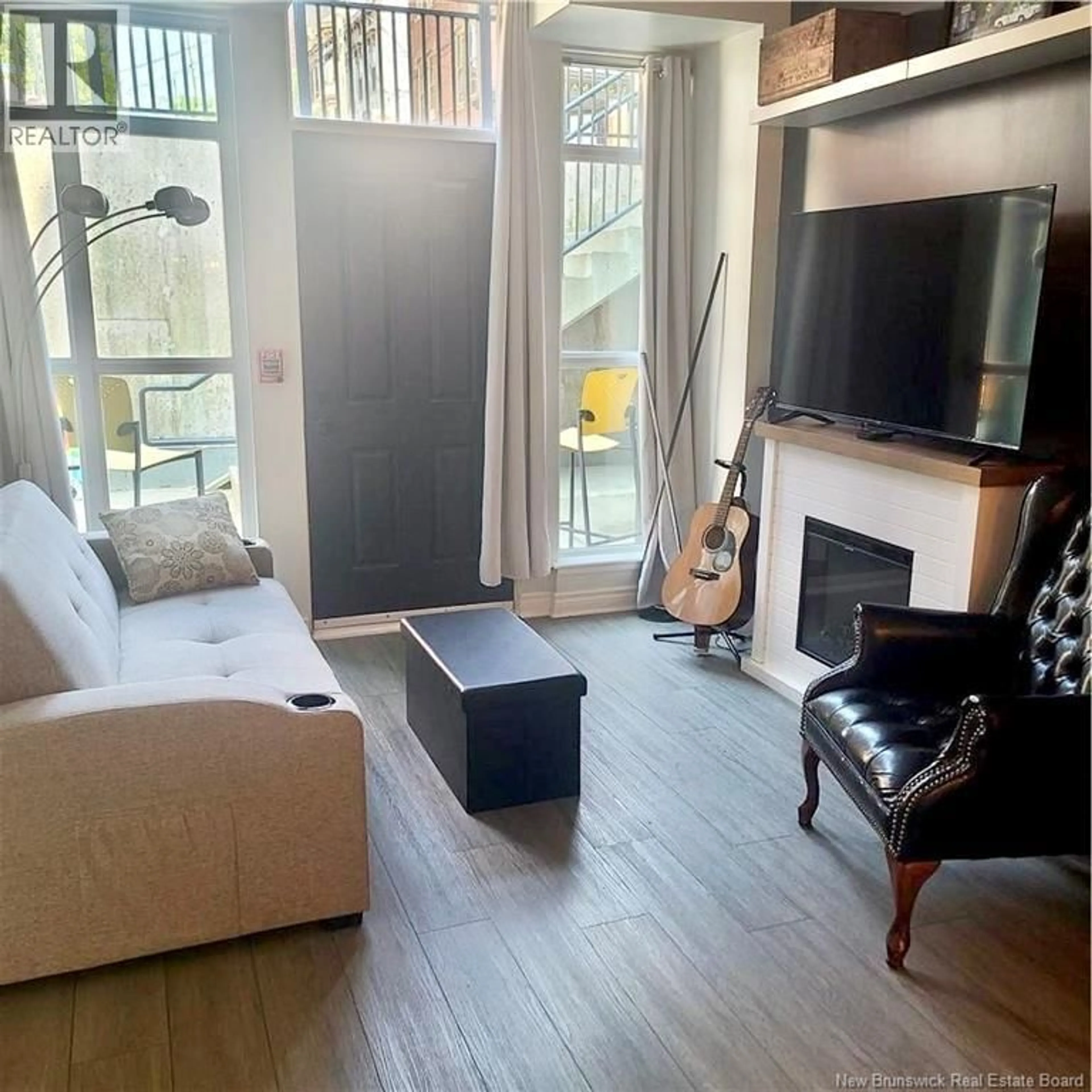 Living room with furniture, wood/laminate floor for 120 - 243 PRINCE WILLIAM STREET, Saint John New Brunswick E2L0C6