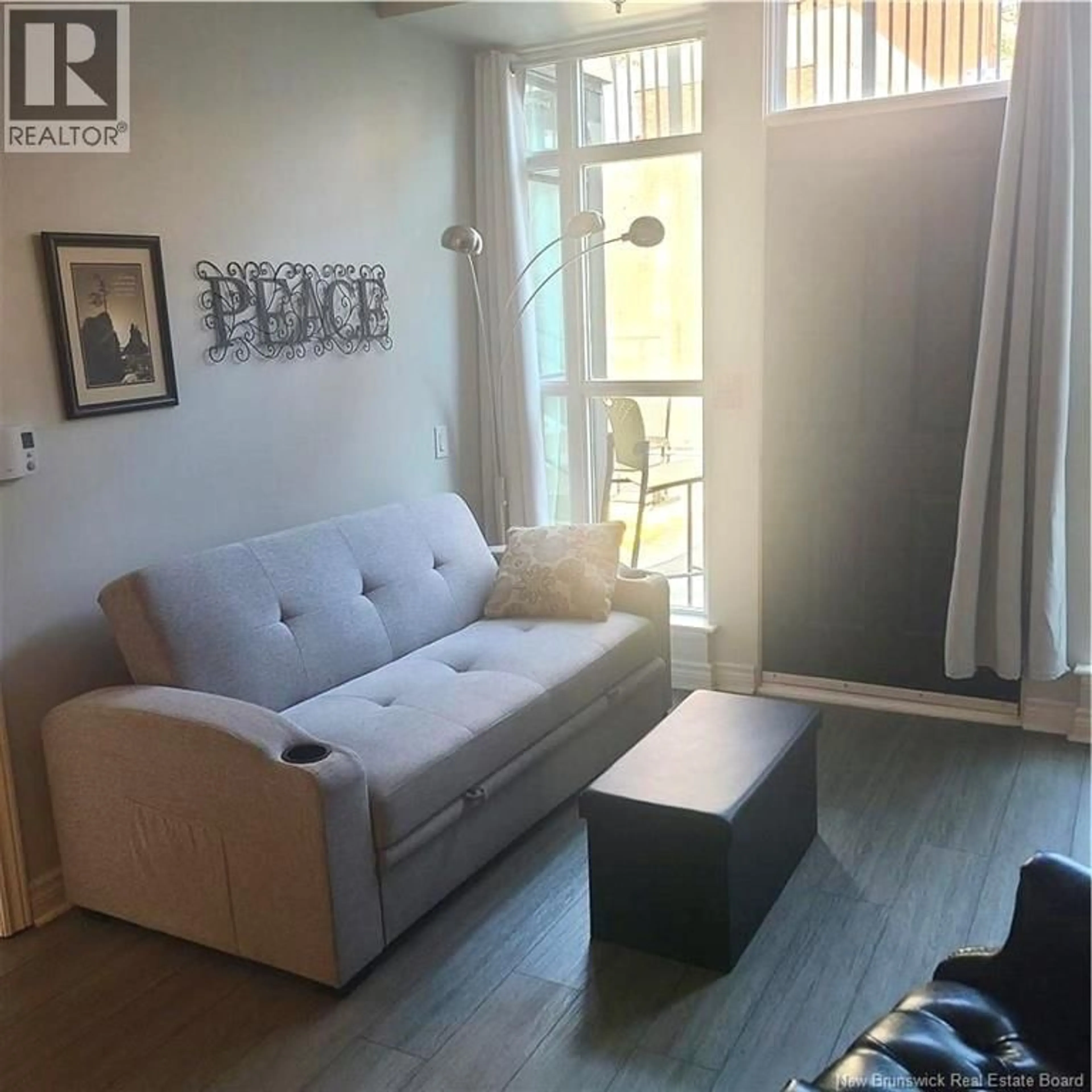 Living room with furniture, wood/laminate floor for 120 - 243 PRINCE WILLIAM STREET, Saint John New Brunswick E2L0C6