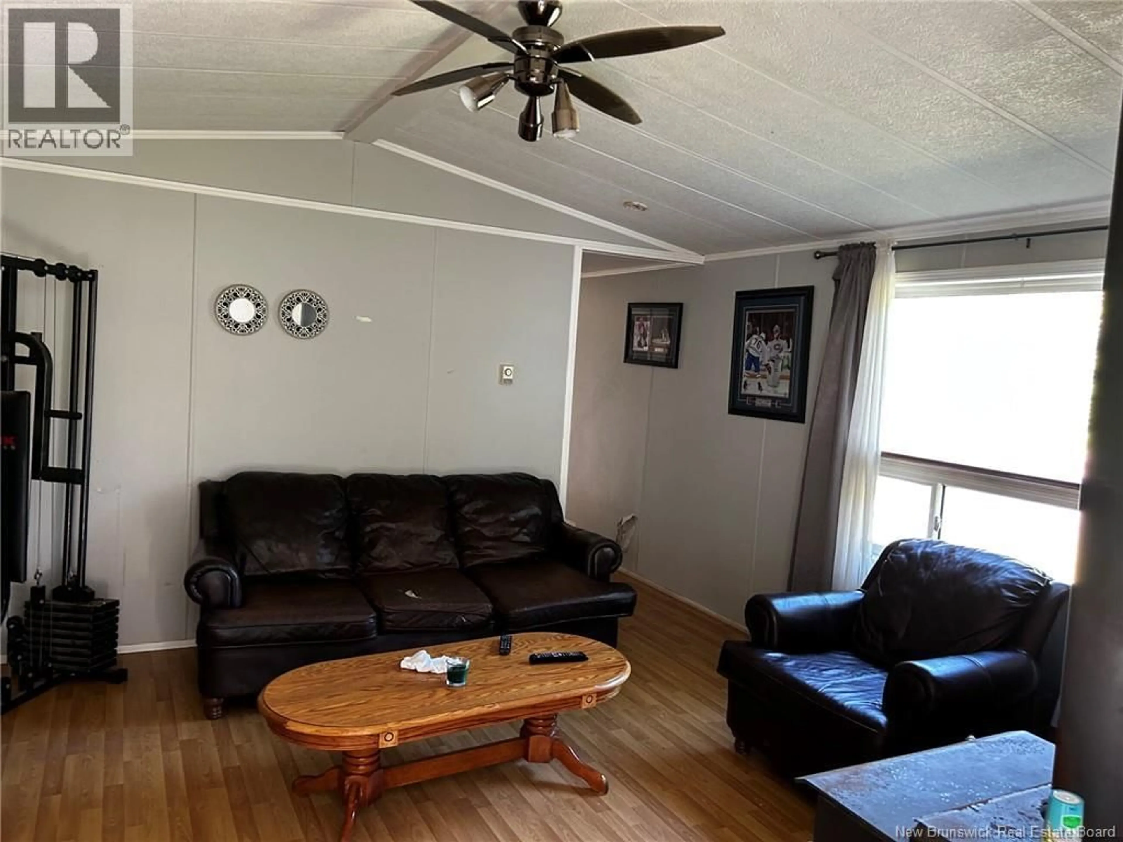 Living room with furniture, wood/laminate floor for 70 CANAL ROAD, Canal New Brunswick E5C1K1