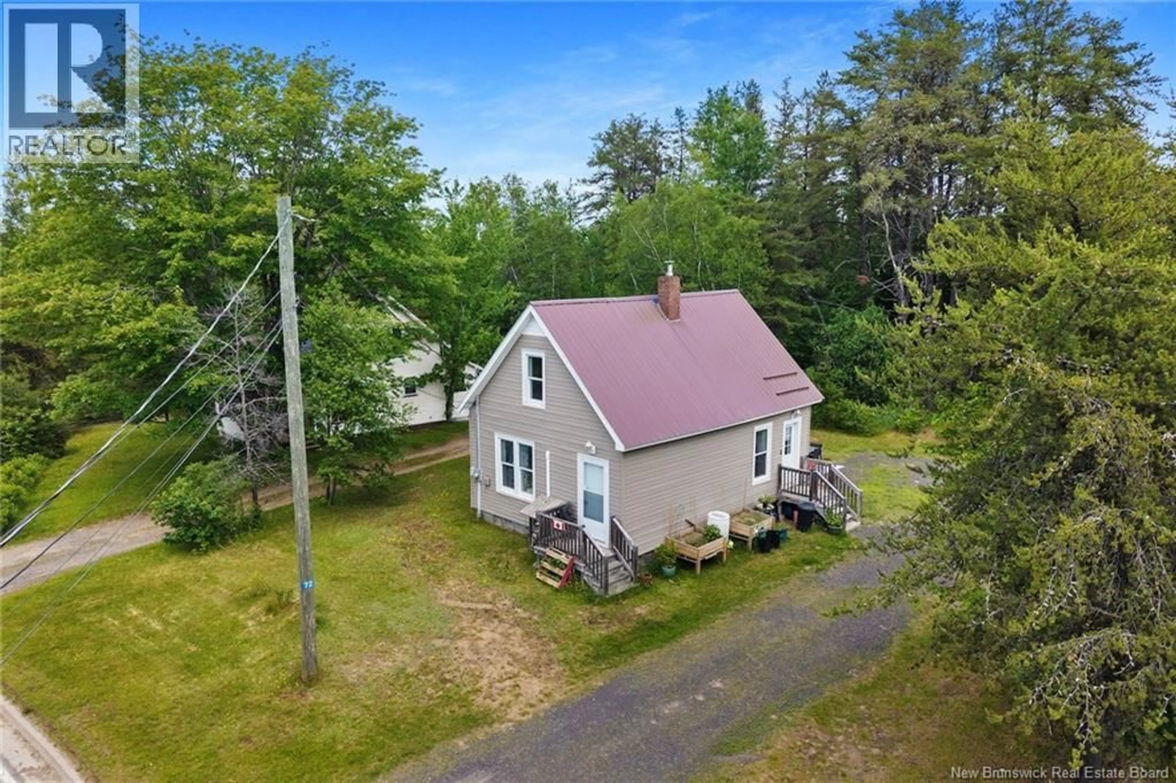 A pic from outside/outdoor area/front of a property/back of a property/a pic from drone, unknown for 72 MCLEOD AVE, Chipman New Brunswick E4A2B8
