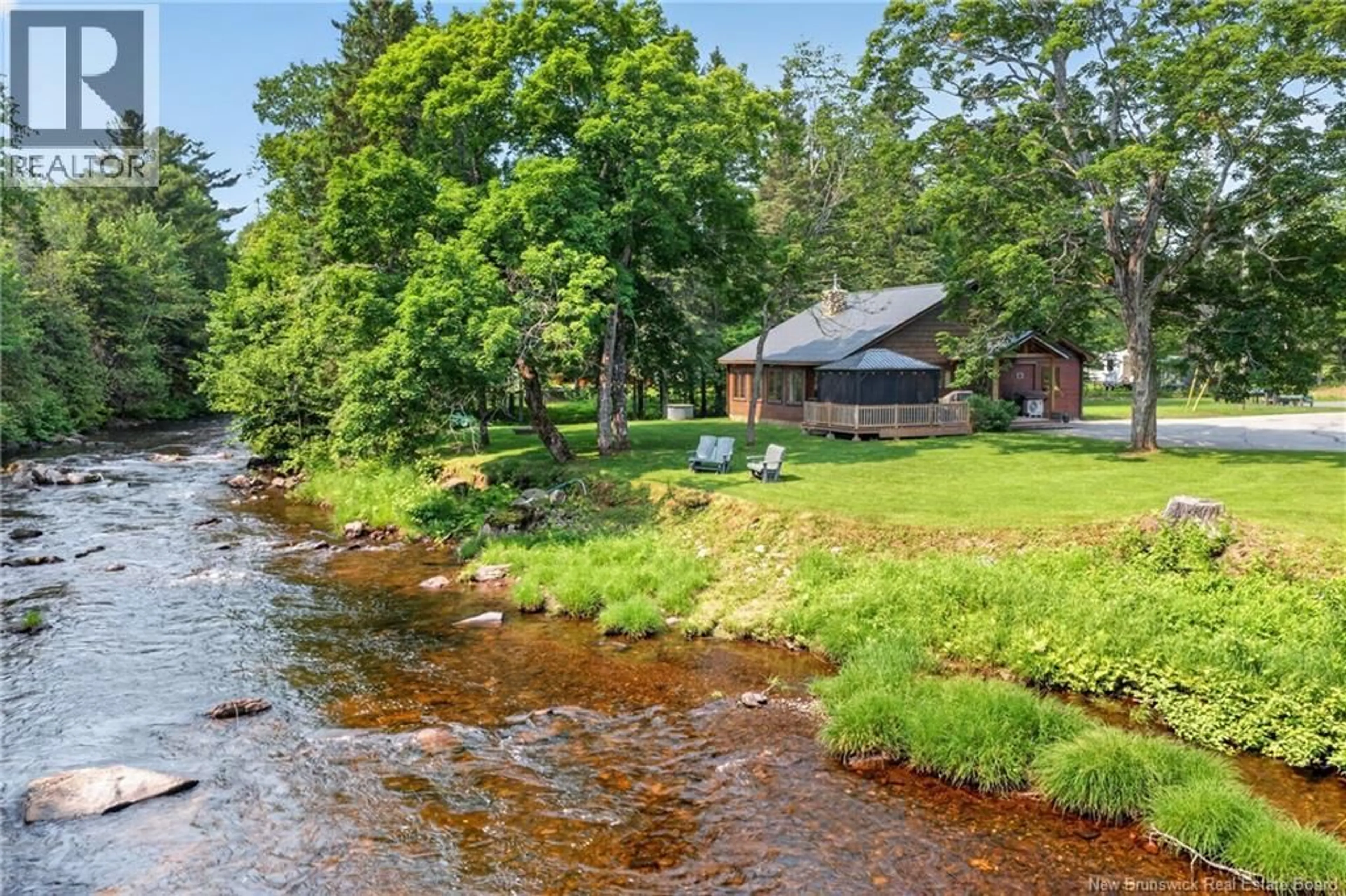 A pic from outside/outdoor area/front of a property/back of a property/a pic from drone, water/lake/river/ocean view for 38 BLUE JAY LANE, Middle River New Brunswick E2A7L6