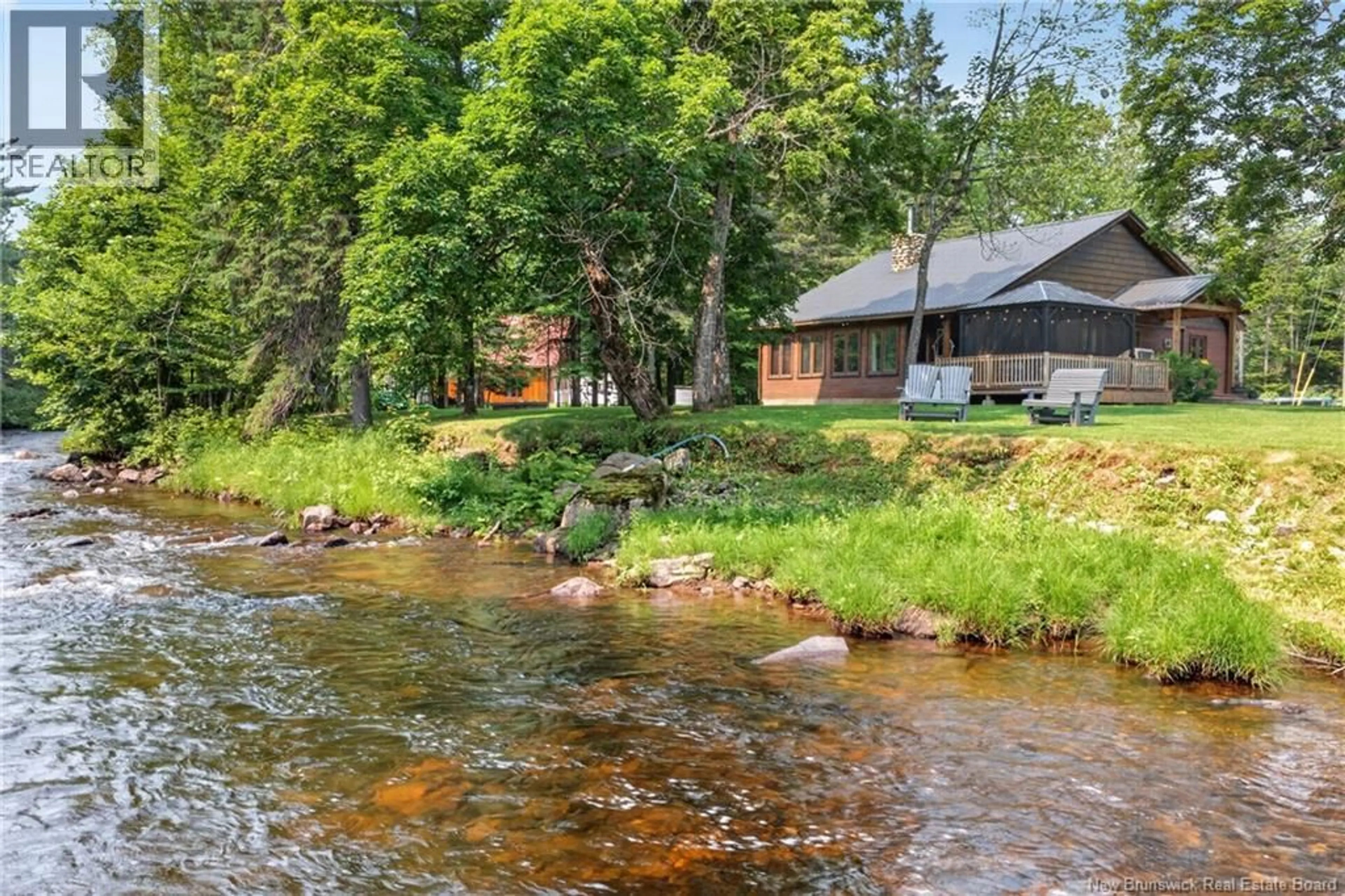 A pic from outside/outdoor area/front of a property/back of a property/a pic from drone, water/lake/river/ocean view for 38 BLUE JAY LANE, Middle River New Brunswick E2A7L6