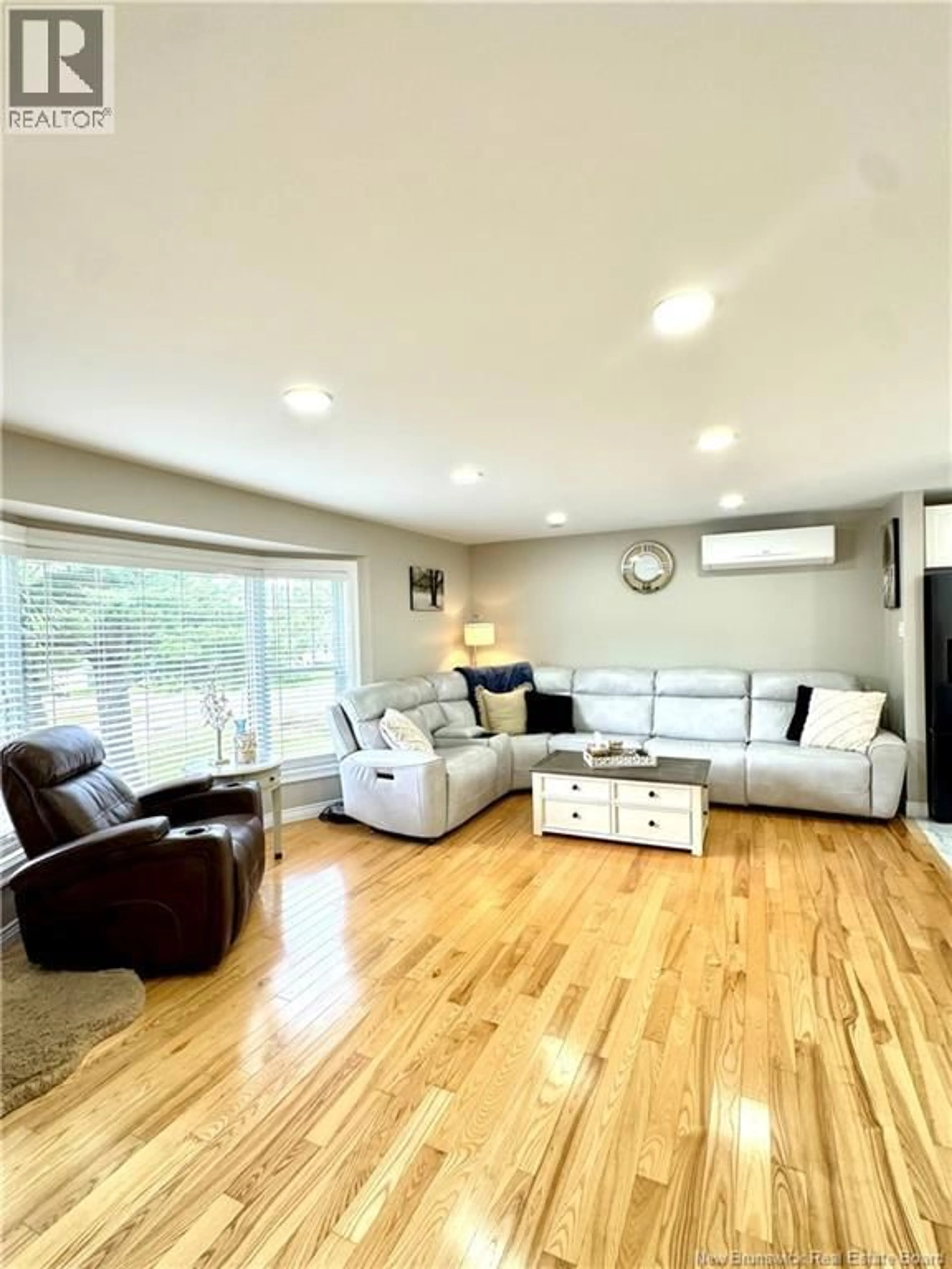 Living room with furniture, wood/laminate floor for 10 WILSON DRIVE, Miramichi New Brunswick E1N3L1