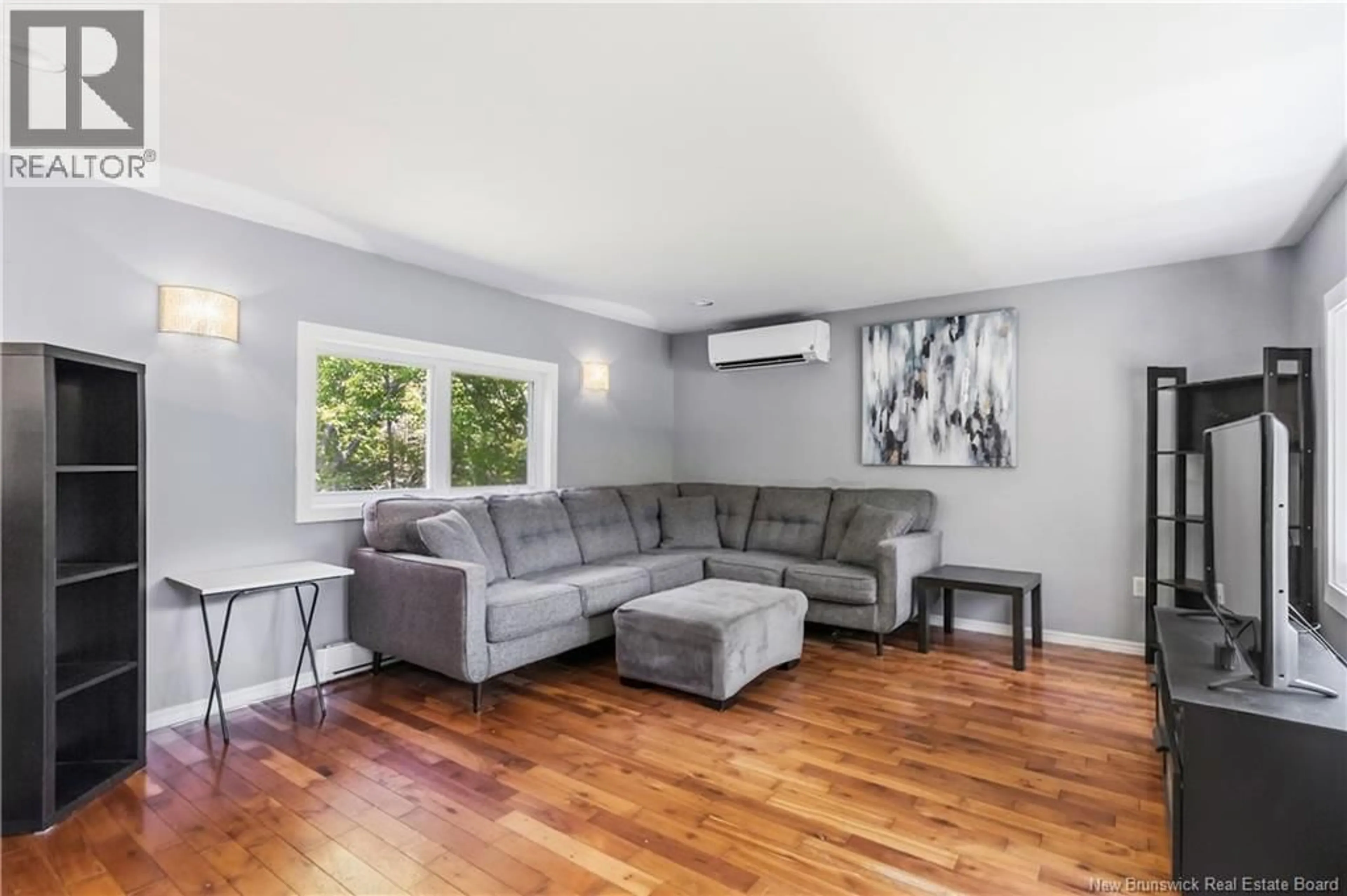 Living room with furniture, wood/laminate floor for 38 KIERSTEAD STREET, Lower Coverdale New Brunswick E1J1G7