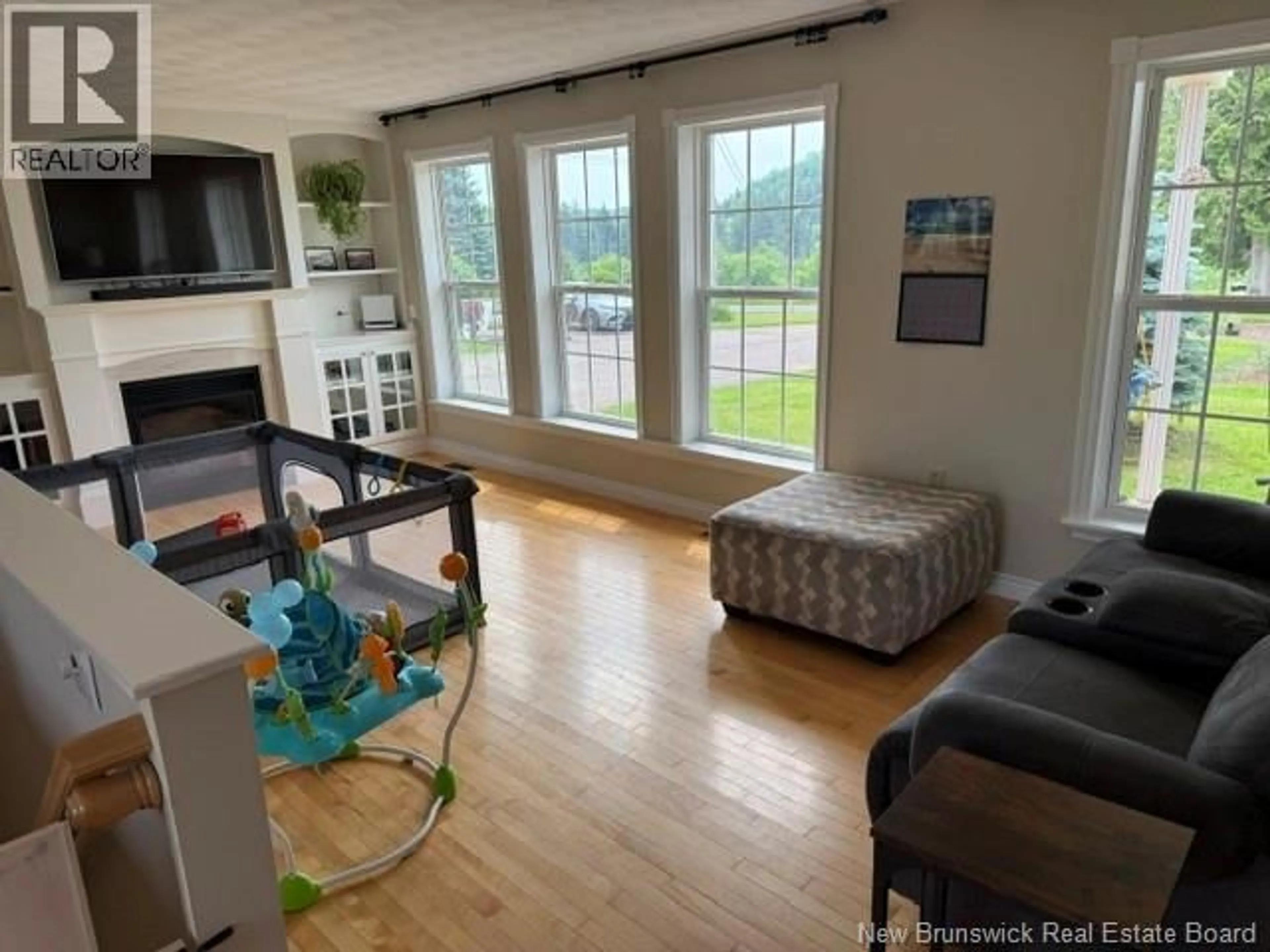 Living room with furniture, wood/laminate floor for 12 GLENVALE ROAD, Petitcodiac New Brunswick E4Z4J1