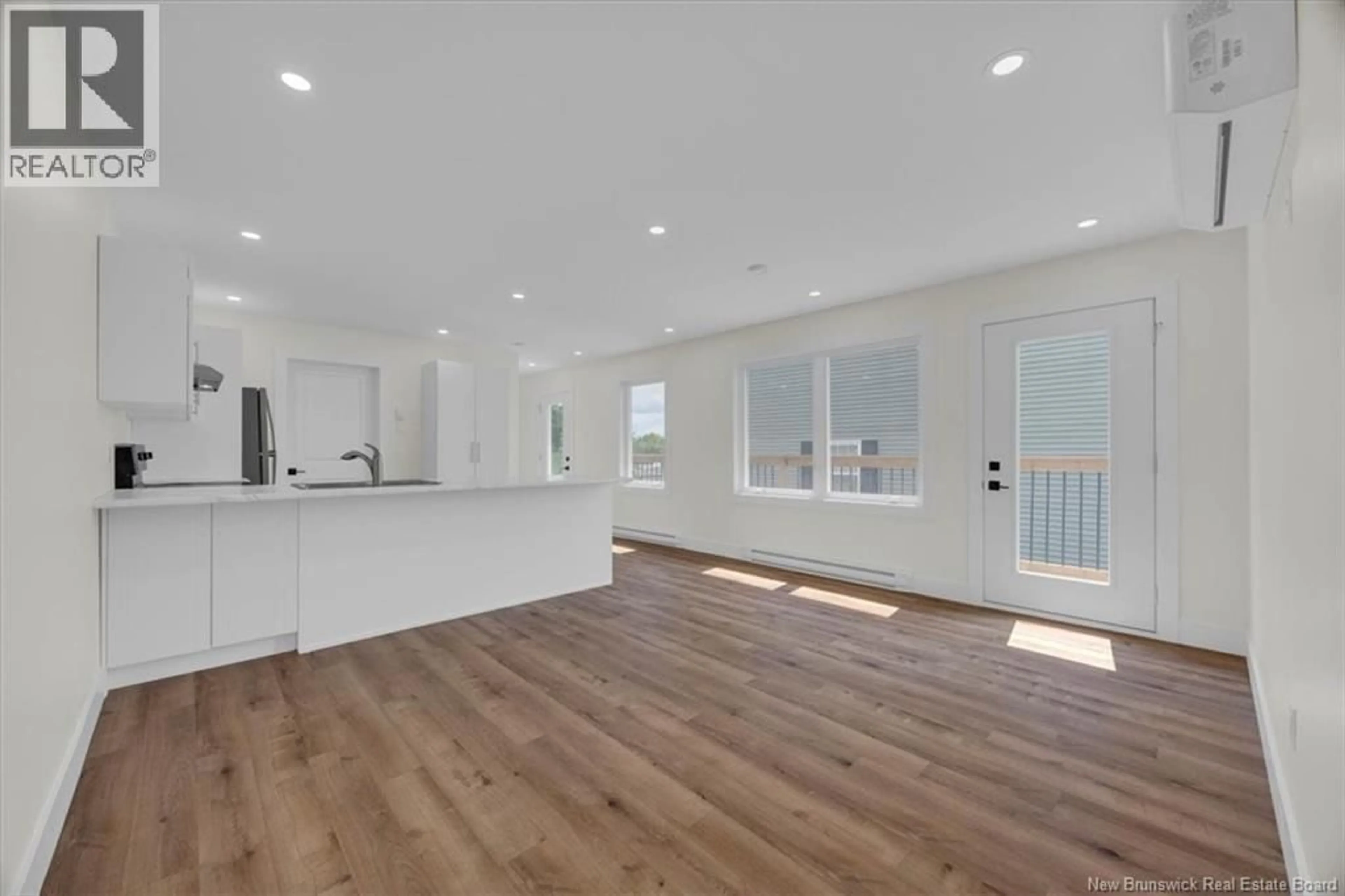 Open concept kitchen, wood/laminate floor for 18 HELENA DRIVE, Saint John New Brunswick E2J0E6