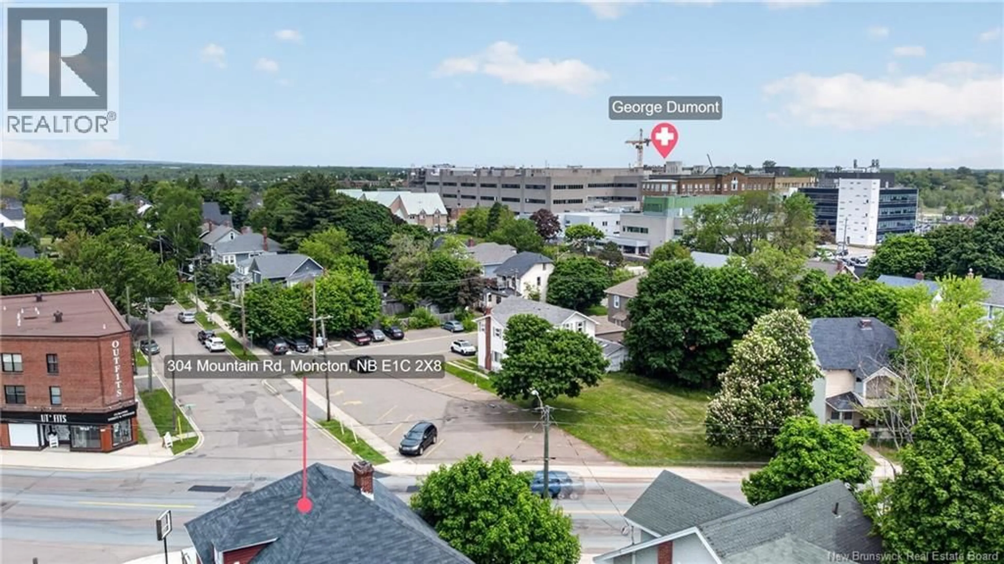 A pic from outside/outdoor area/front of a property/back of a property/a pic from drone, water/lake/river/ocean view for 300-304 MOUNTAIN ROAD, Moncton New Brunswick E1C2X8