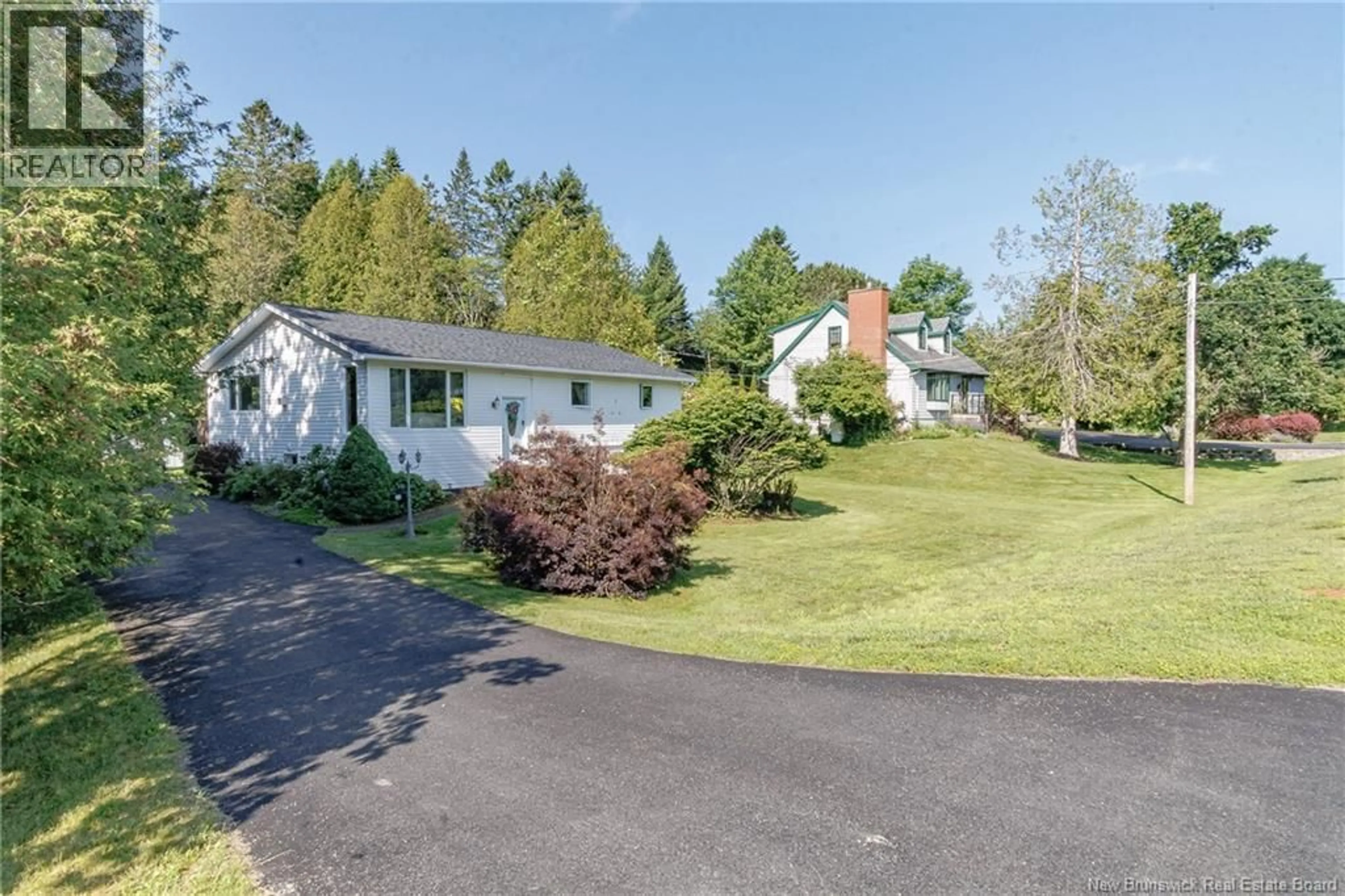 A pic from outside/outdoor area/front of a property/back of a property/a pic from drone, street for 74 QUISPAMSIS ROAD, Quispamsis New Brunswick E2E1N7