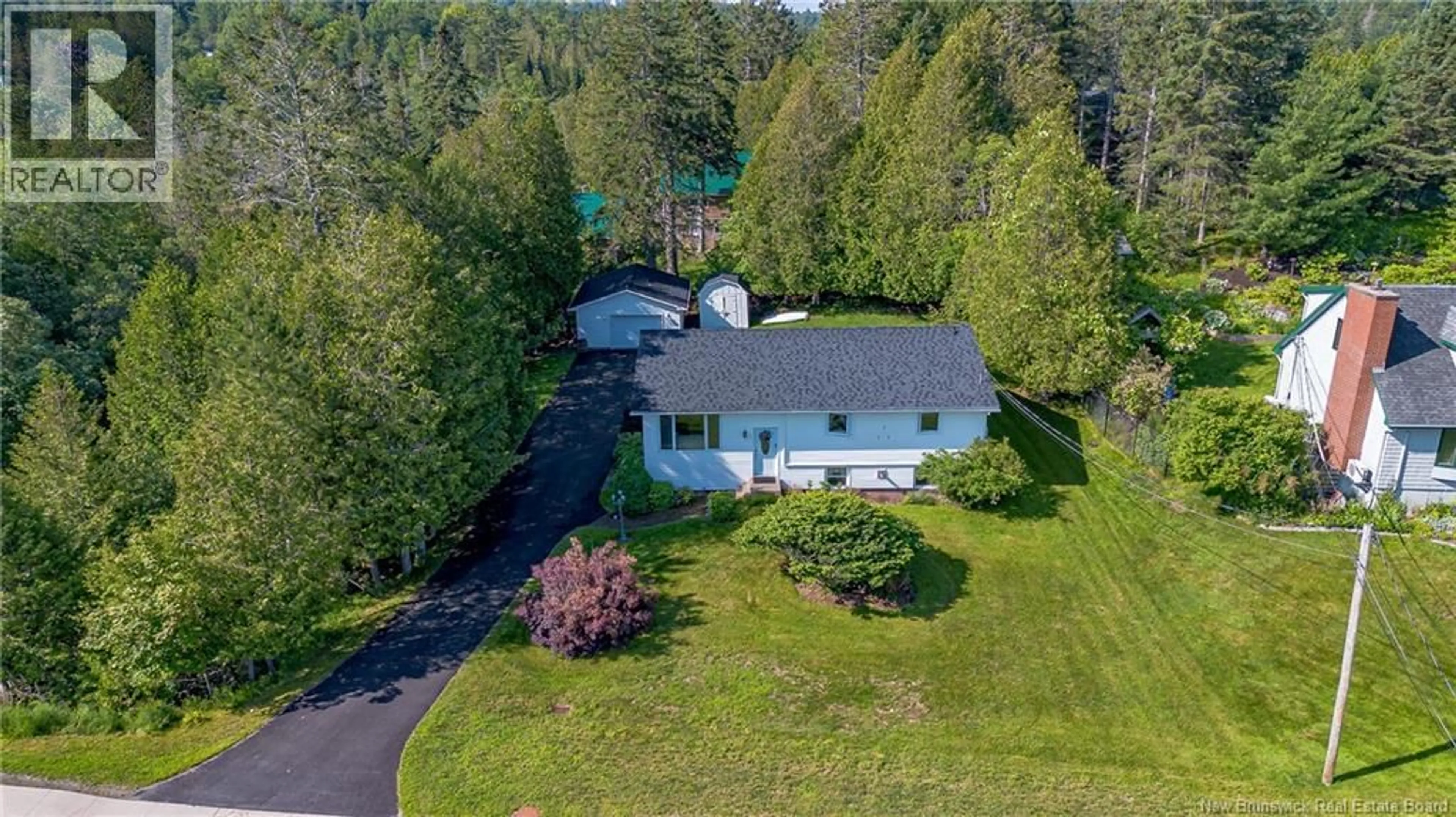 A pic from outside/outdoor area/front of a property/back of a property/a pic from drone, unknown for 74 QUISPAMSIS ROAD, Quispamsis New Brunswick E2E1N7