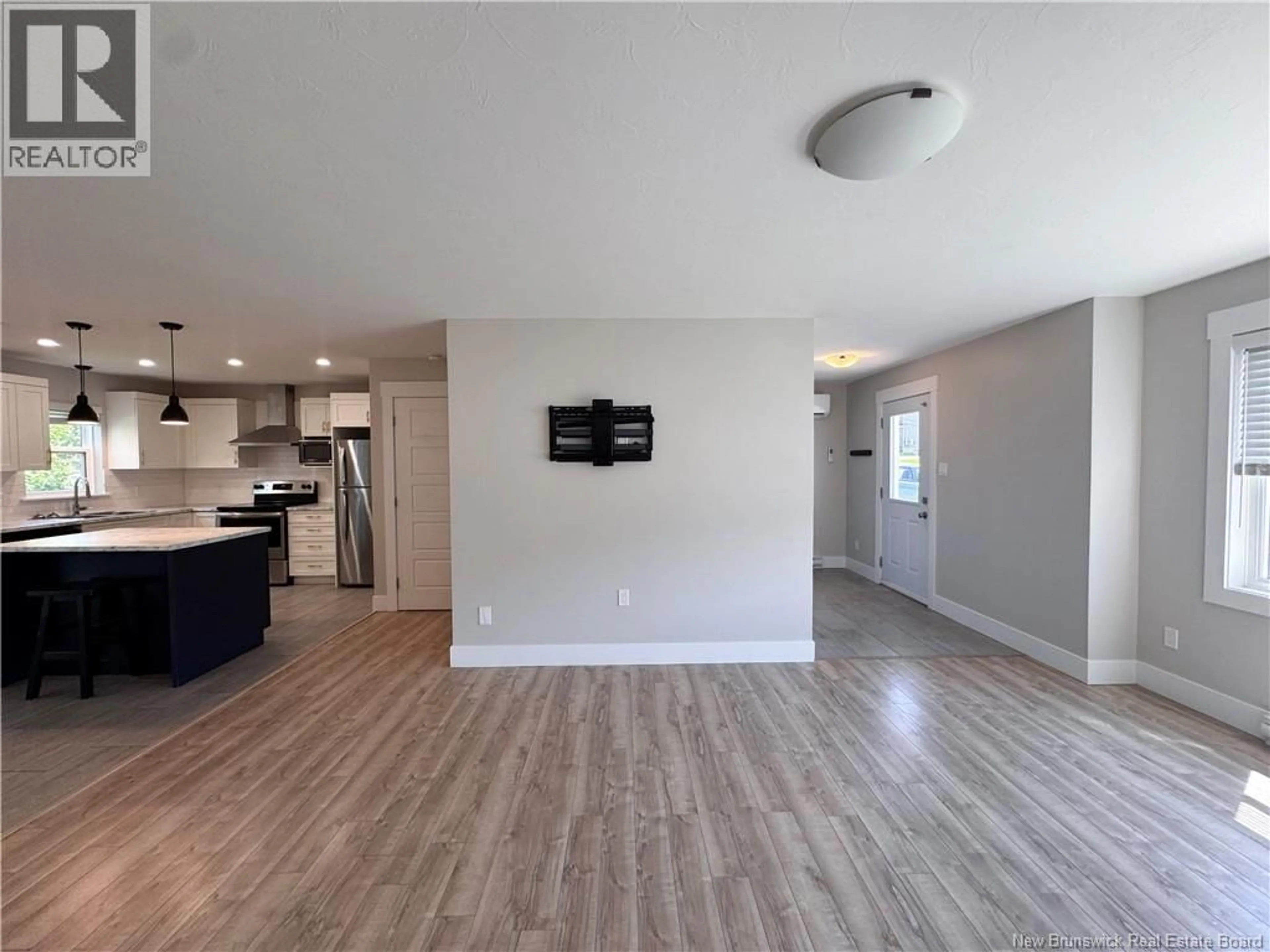 Open concept kitchen, wood/laminate floor for 58 DES PEUPLIERS, Dieppe New Brunswick E1A9E4
