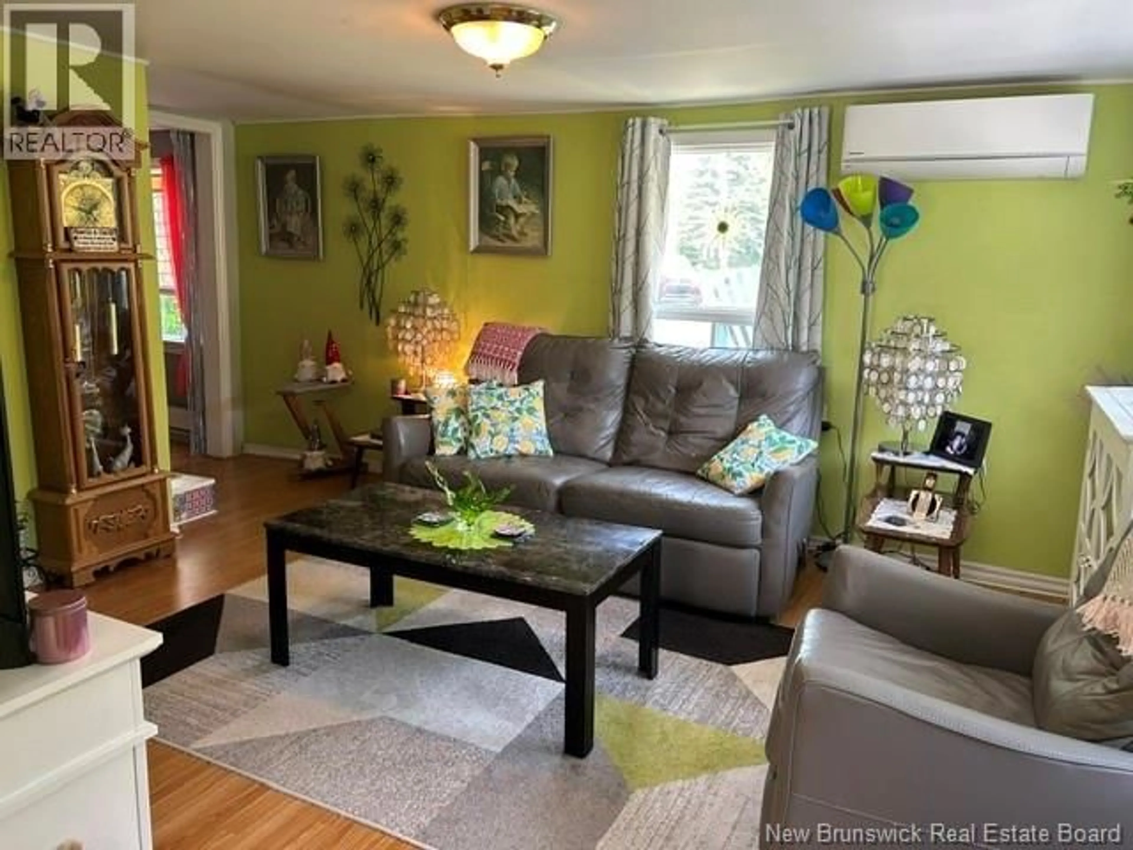 Living room with furniture, wood/laminate floor for 111 WATER STREET, Bath New Brunswick E7J1E8