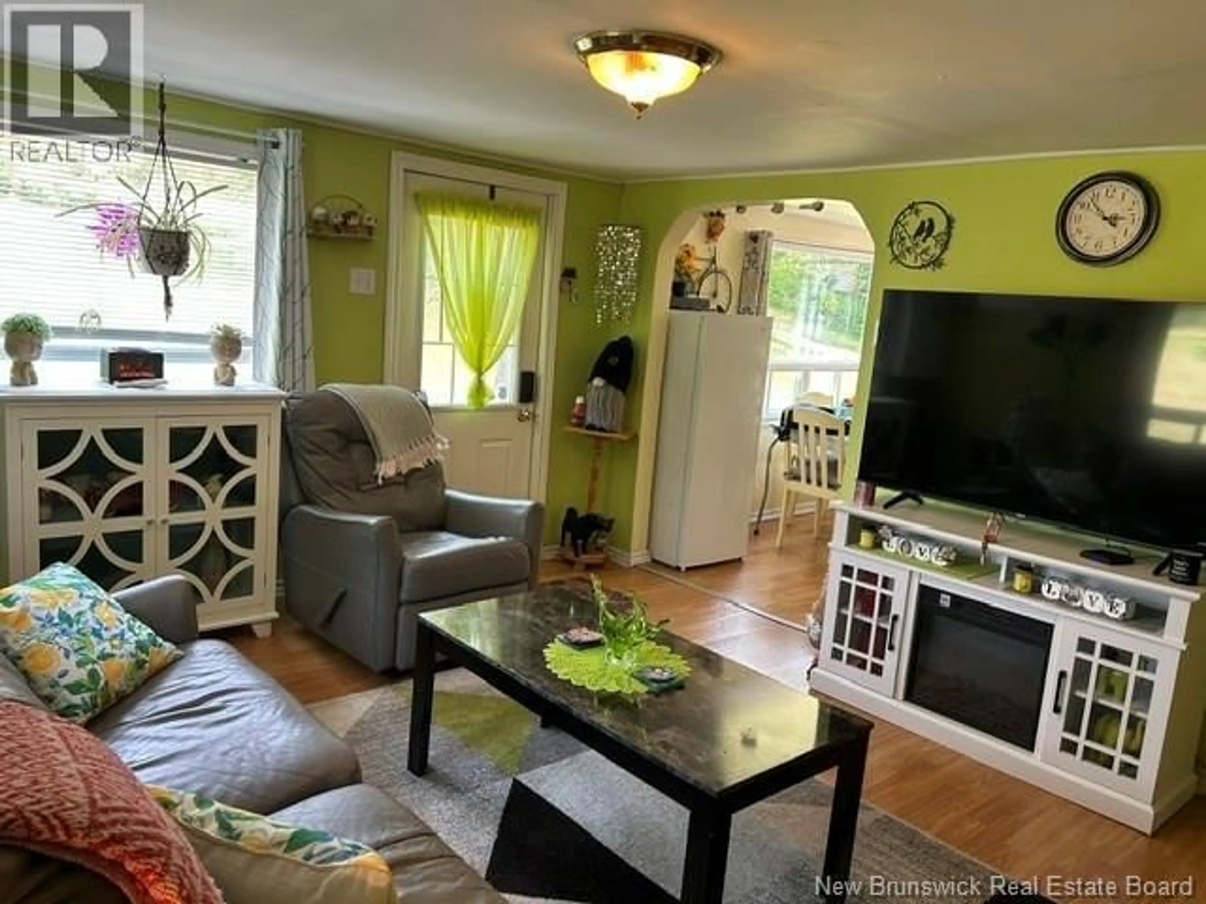 Living room with furniture, wood/laminate floor for 111 WATER STREET, Bath New Brunswick E7J1E8