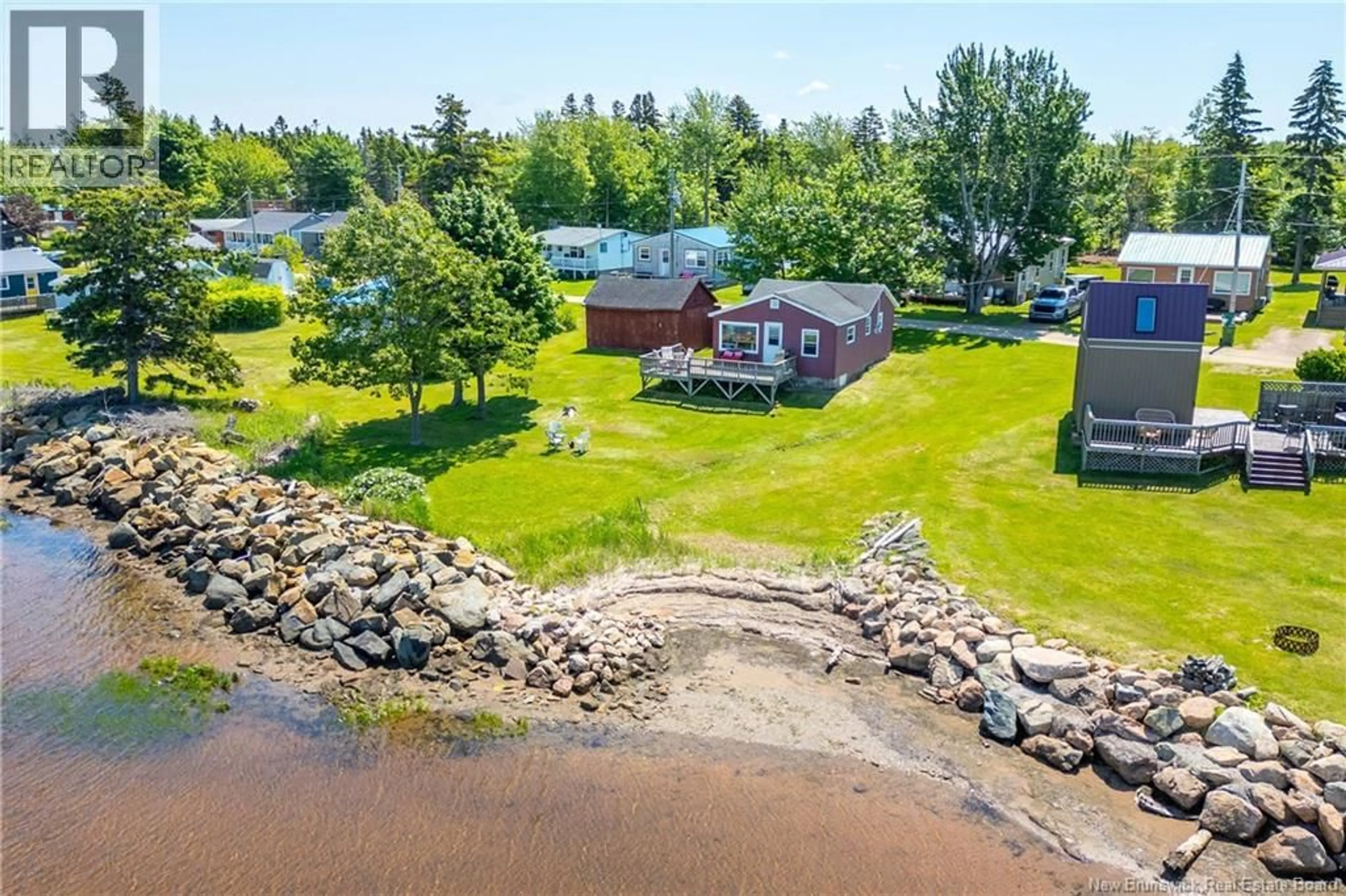 A pic from outside/outdoor area/front of a property/back of a property/a pic from drone, water/lake/river/ocean view for 66 MASON'S BEACH, Baie Verte New Brunswick E4M2Y2