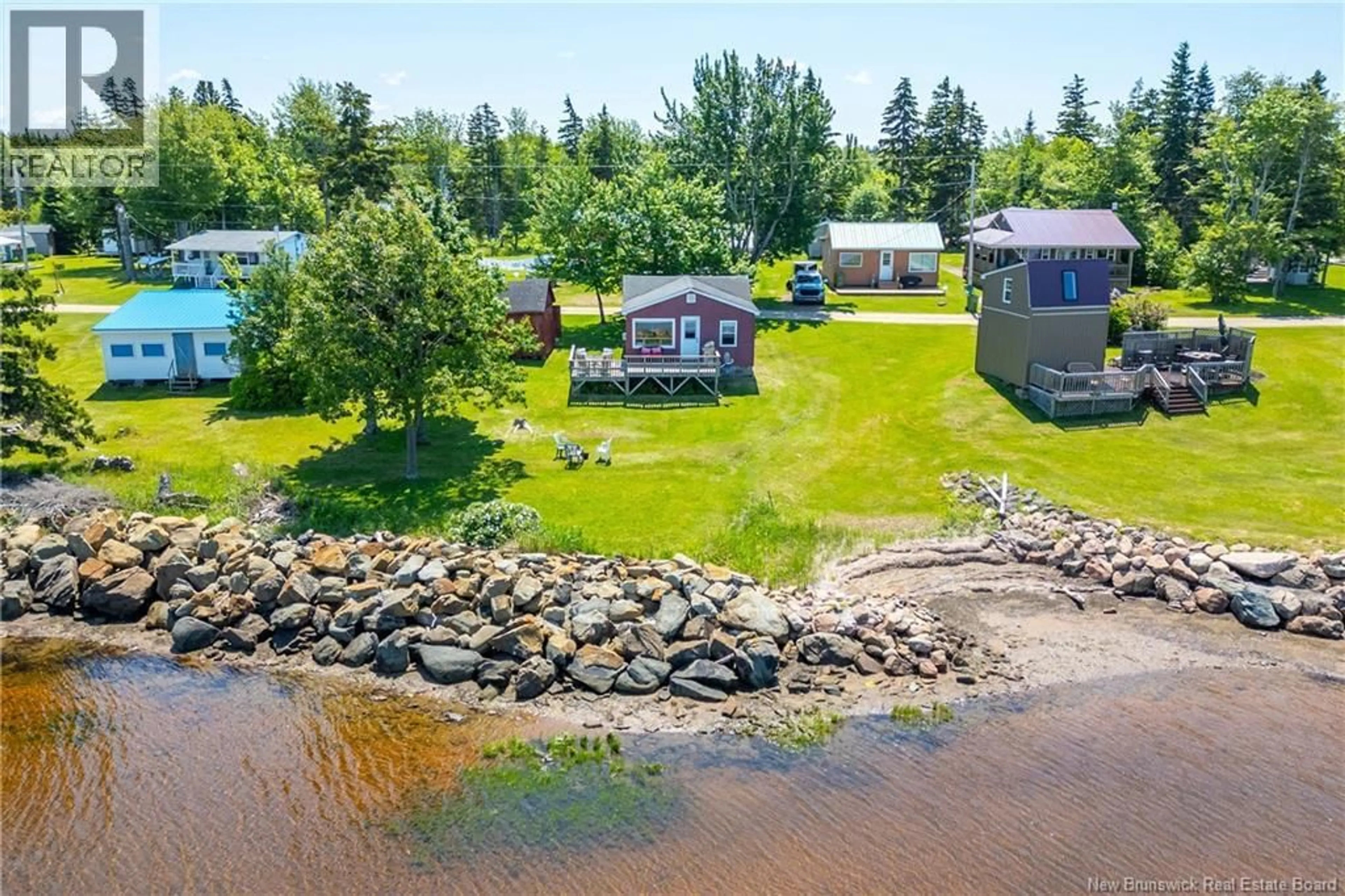 A pic from outside/outdoor area/front of a property/back of a property/a pic from drone, water/lake/river/ocean view for 66 MASON'S BEACH, Baie Verte New Brunswick E4M2Y2