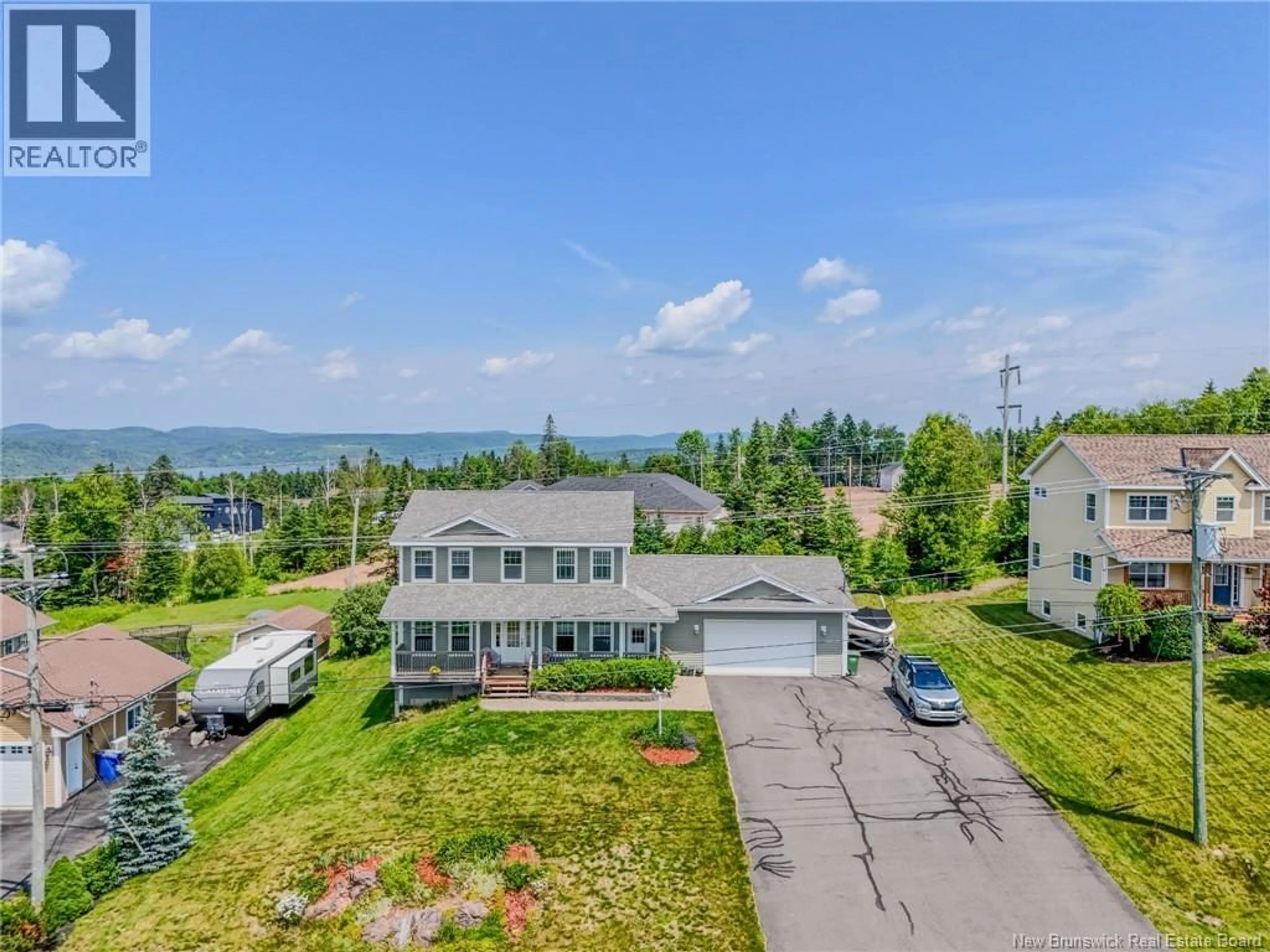 A pic from outside/outdoor area/front of a property/back of a property/a pic from drone, water/lake/river/ocean view for 75 FLAGSTONE DRIVE, Quispamsis New Brunswick E2G0B9