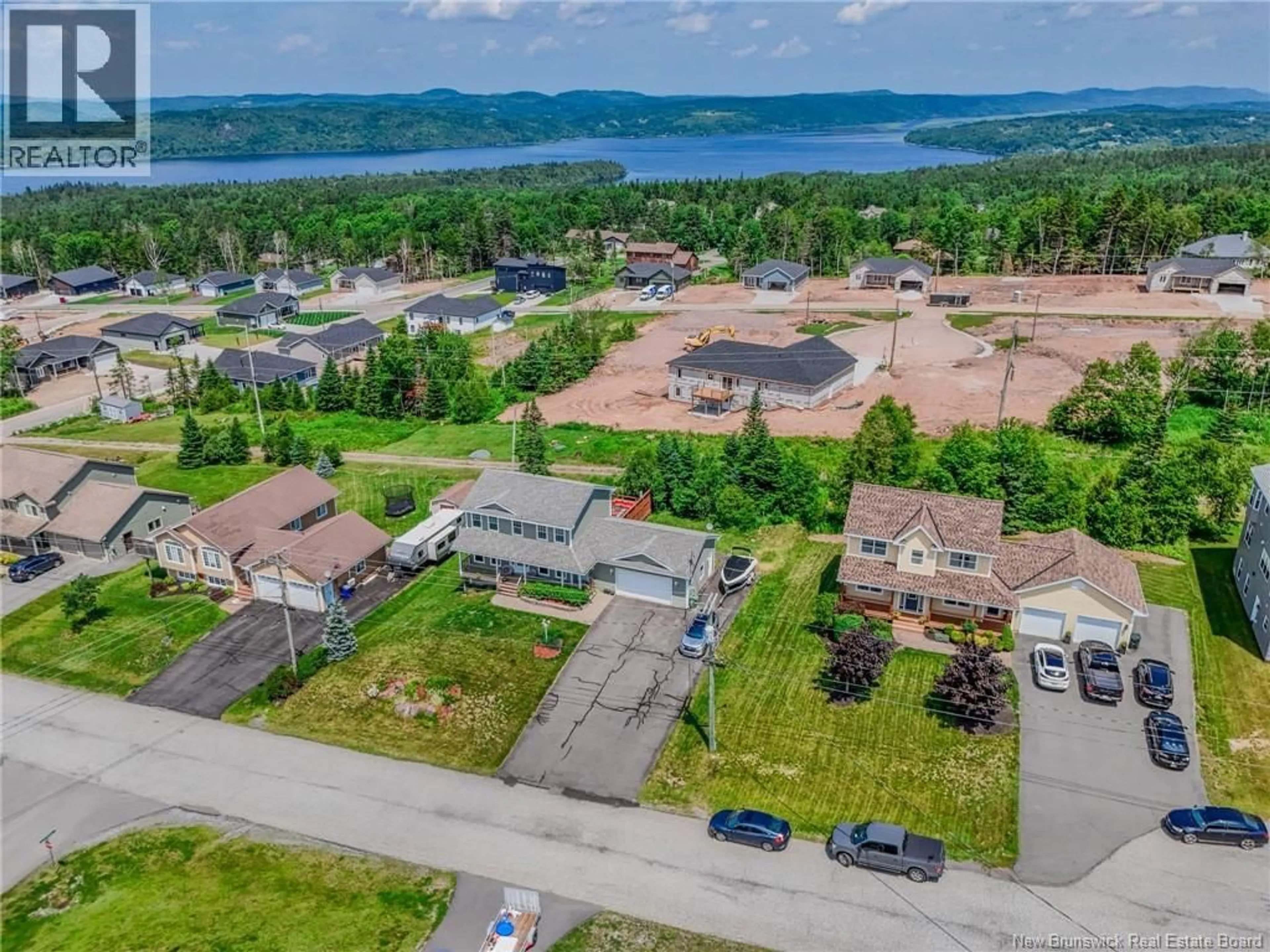A pic from outside/outdoor area/front of a property/back of a property/a pic from drone, water/lake/river/ocean view for 75 FLAGSTONE DRIVE, Quispamsis New Brunswick E2G0B9