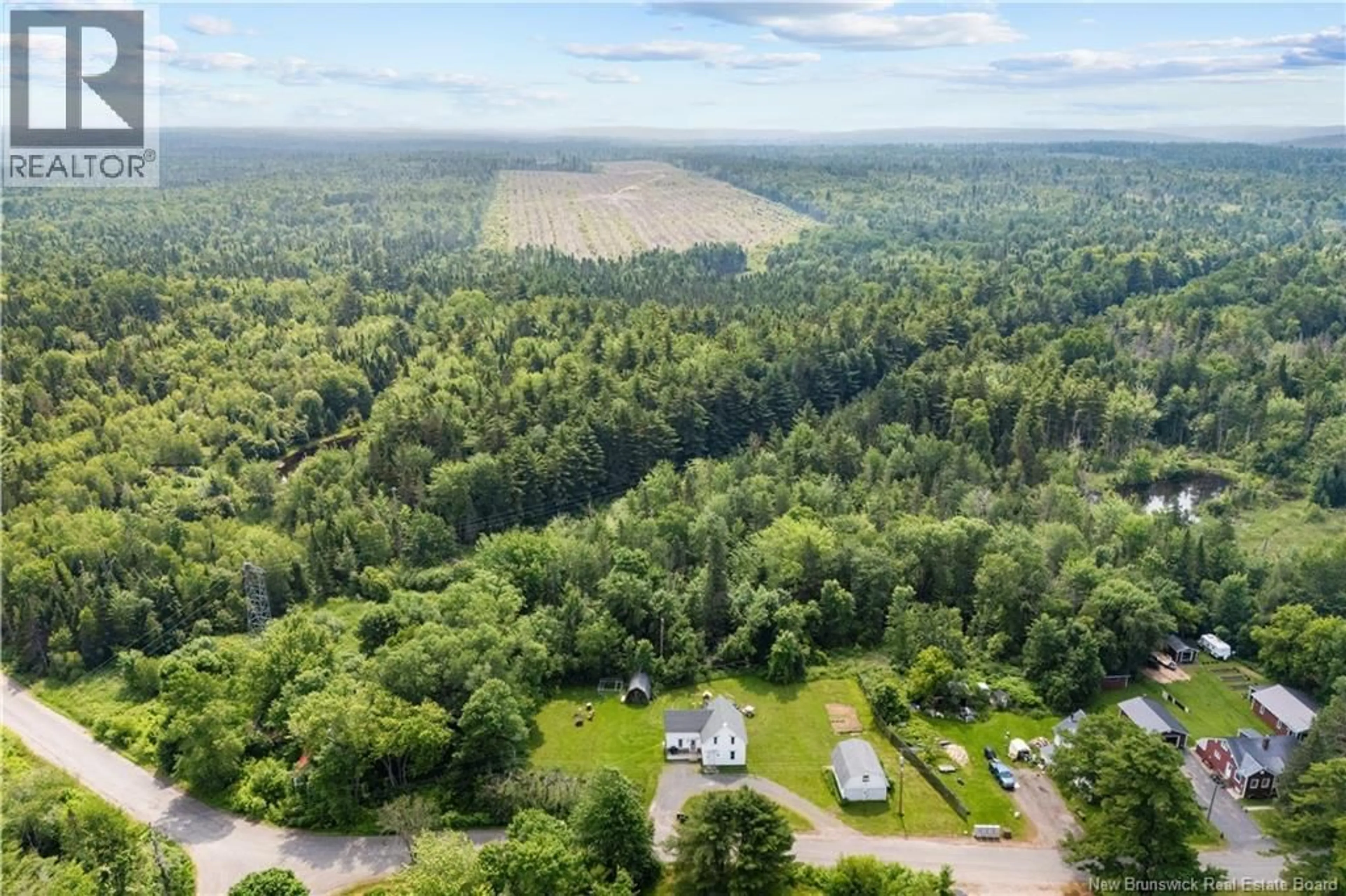 A pic from outside/outdoor area/front of a property/back of a property/a pic from drone, forest/trees view for 24 SOUTH CANAAN ROAD, Coles Island New Brunswick E4C2R9