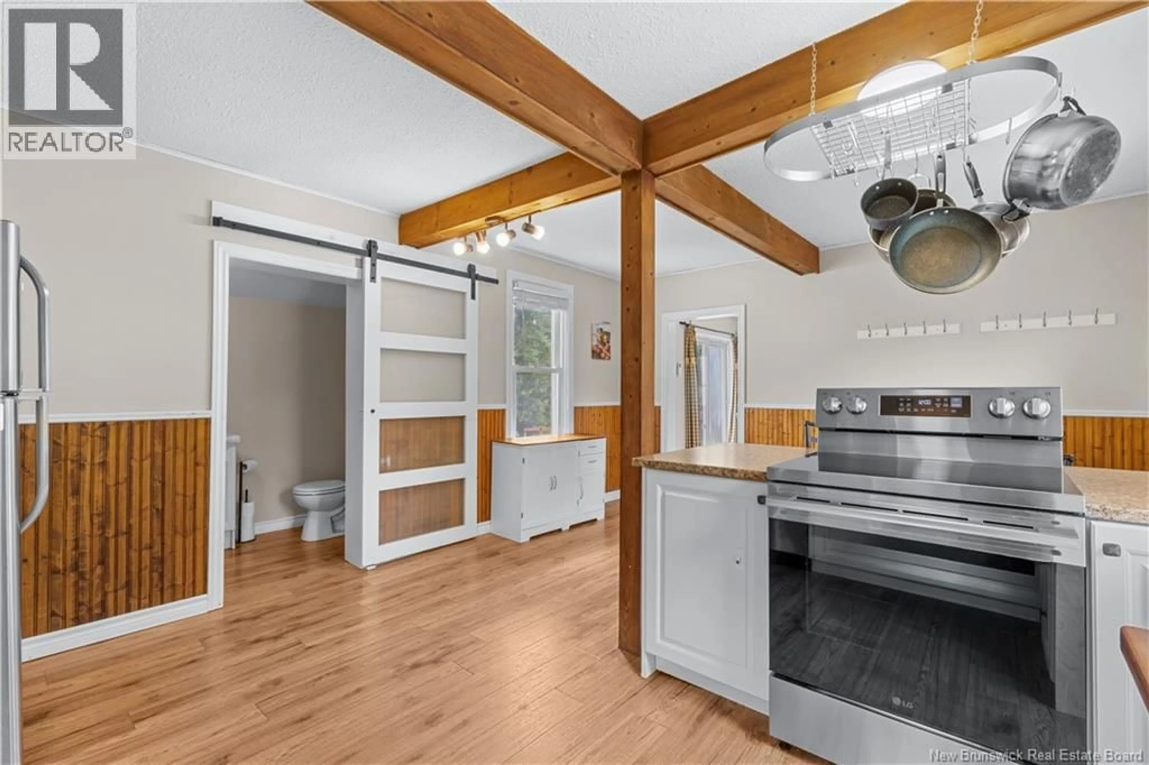 Open concept kitchen, wood/laminate floor for 24 SOUTH CANAAN ROAD, Coles Island New Brunswick E4C2R9
