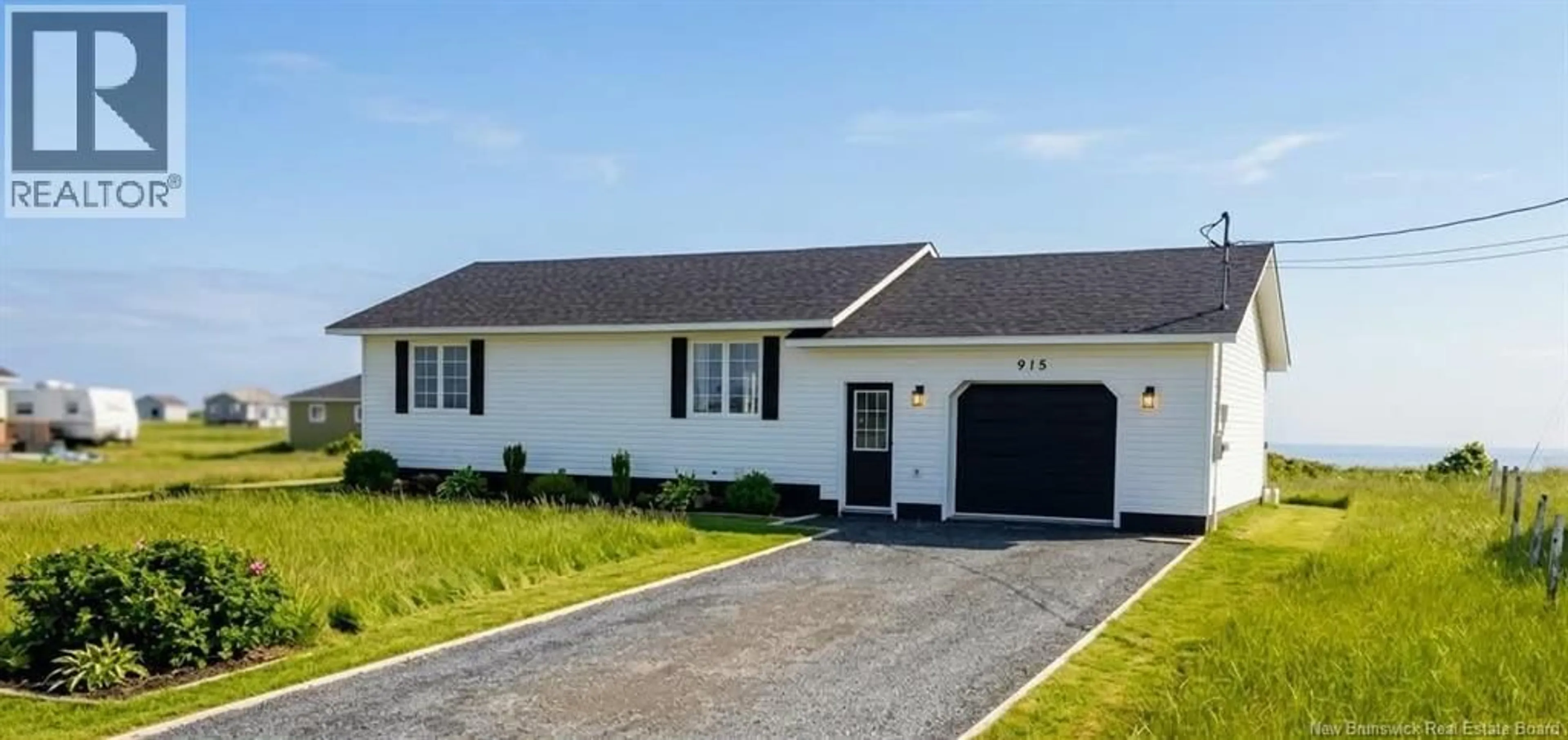 Home with vinyl exterior material, street for 915 JOHN CORMIER, Beresford New Brunswick E8K1W2