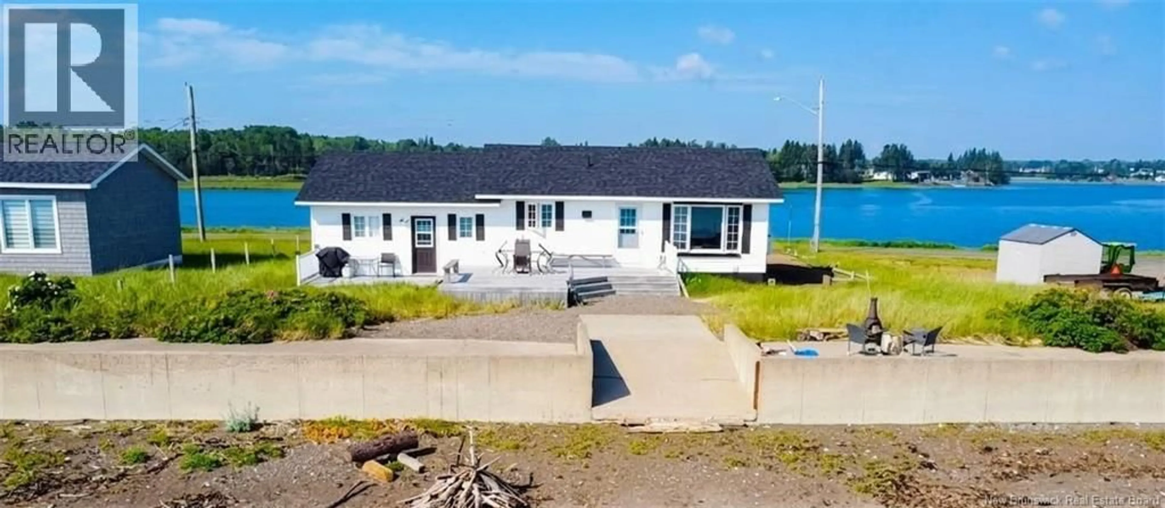 A pic from outside/outdoor area/front of a property/back of a property/a pic from drone, water/lake/river/ocean view for 915 JOHN CORMIER, Beresford New Brunswick E8K1W2