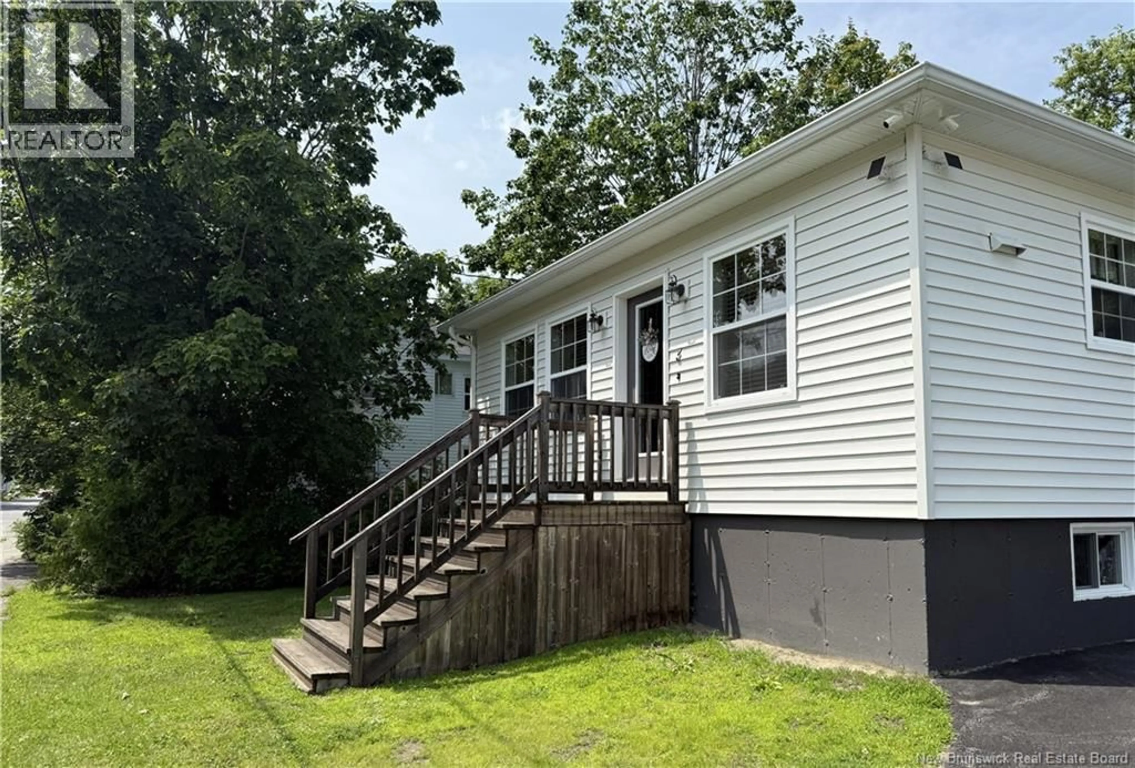 Home with vinyl exterior material, street for 3 VICTORIA STREET, St. Stephen New Brunswick E3L2R2