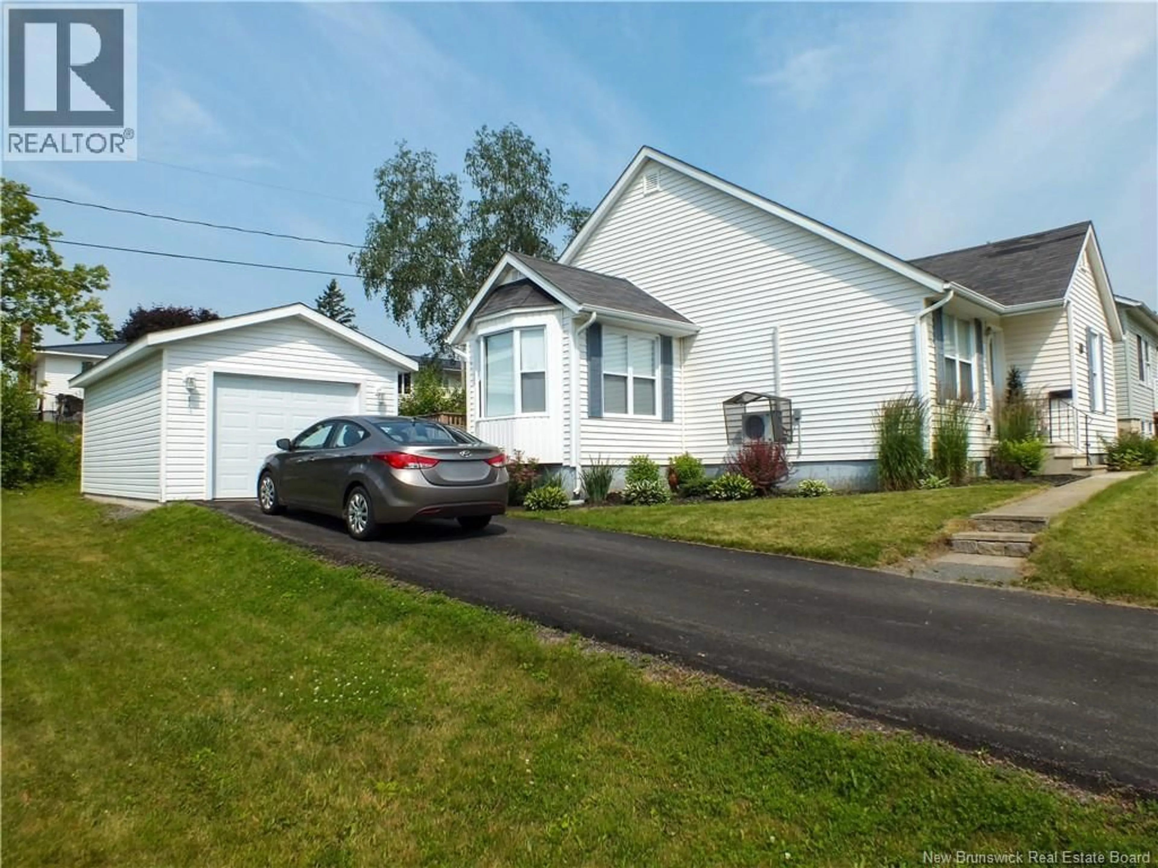 Home with vinyl exterior material, street for 121 CREIGHTON STREET, Woodstock New Brunswick E7M1N4