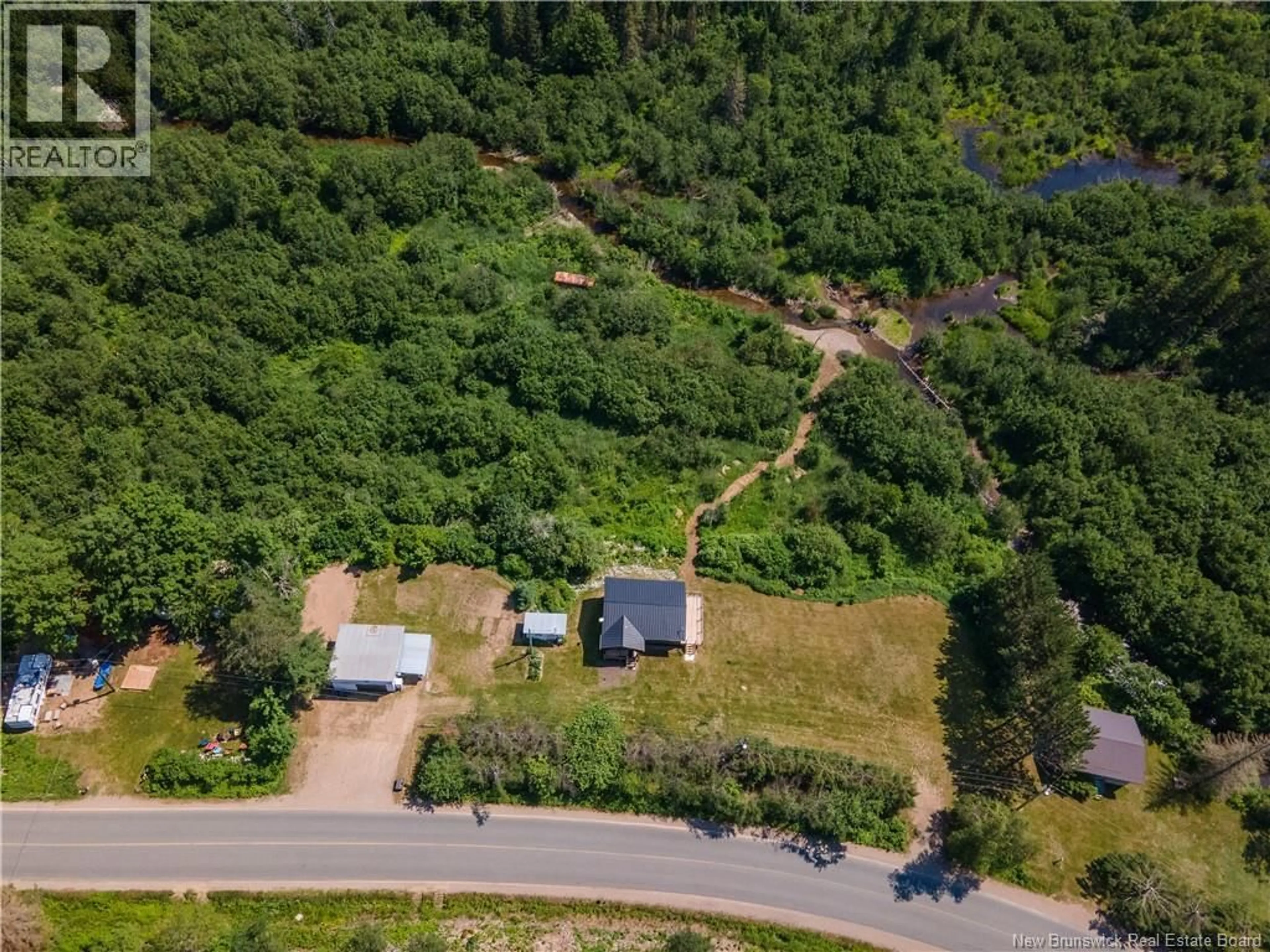 A pic from outside/outdoor area/front of a property/back of a property/a pic from drone, forest/trees view for 11464 ROUTE 114, South Branch New Brunswick E4E5G1