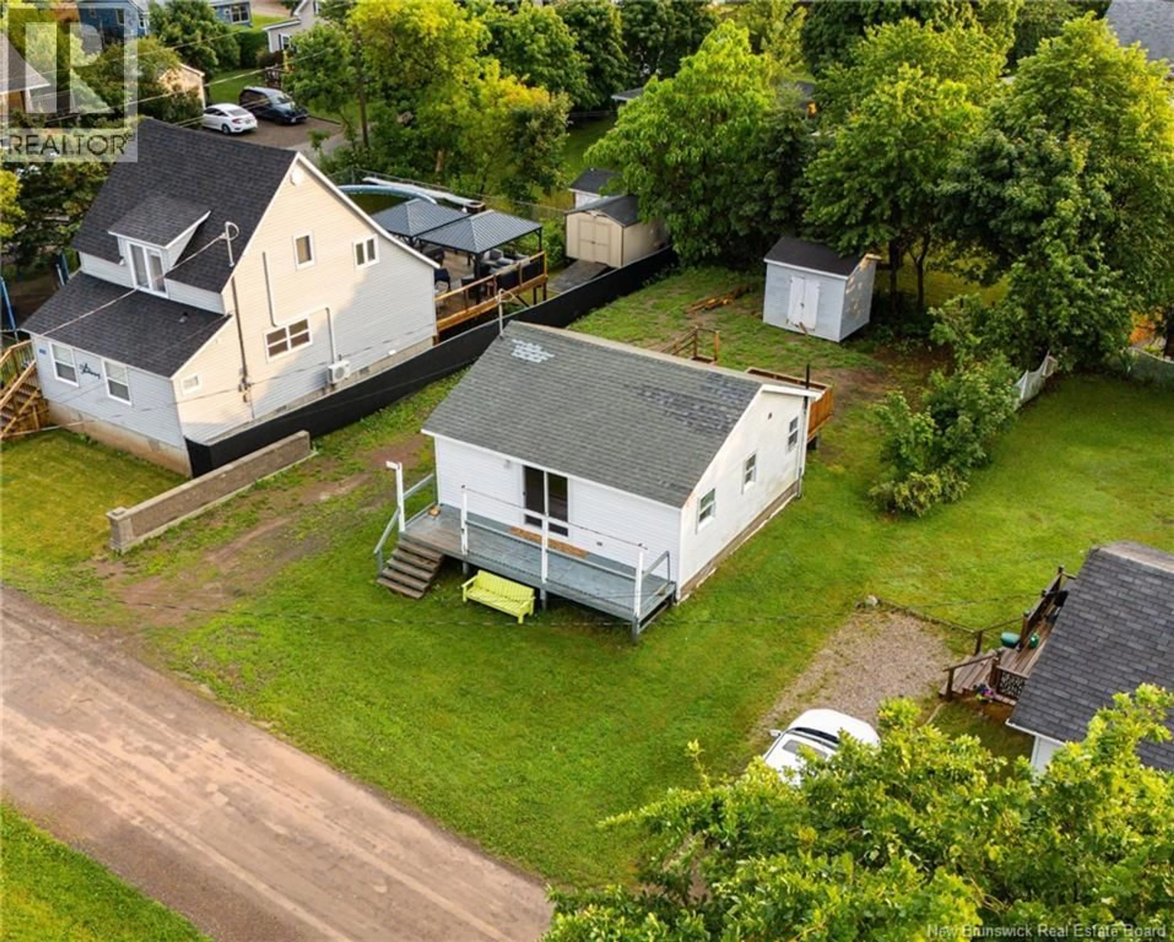 A pic from outside/outdoor area/front of a property/back of a property/a pic from drone, street for 108 THIRD AVENUE, Pointe-Du-Chêne New Brunswick E4P5J1