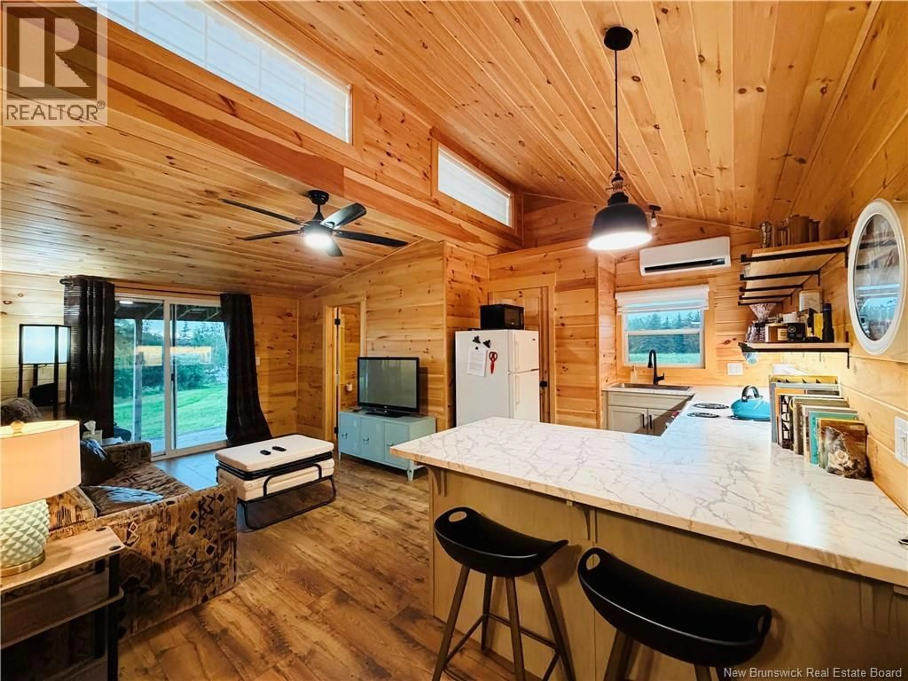 Open concept kitchen, wood/laminate floor for 102 LITTLE BRANCH ROAD, Black River Bridge New Brunswick E1N5N4