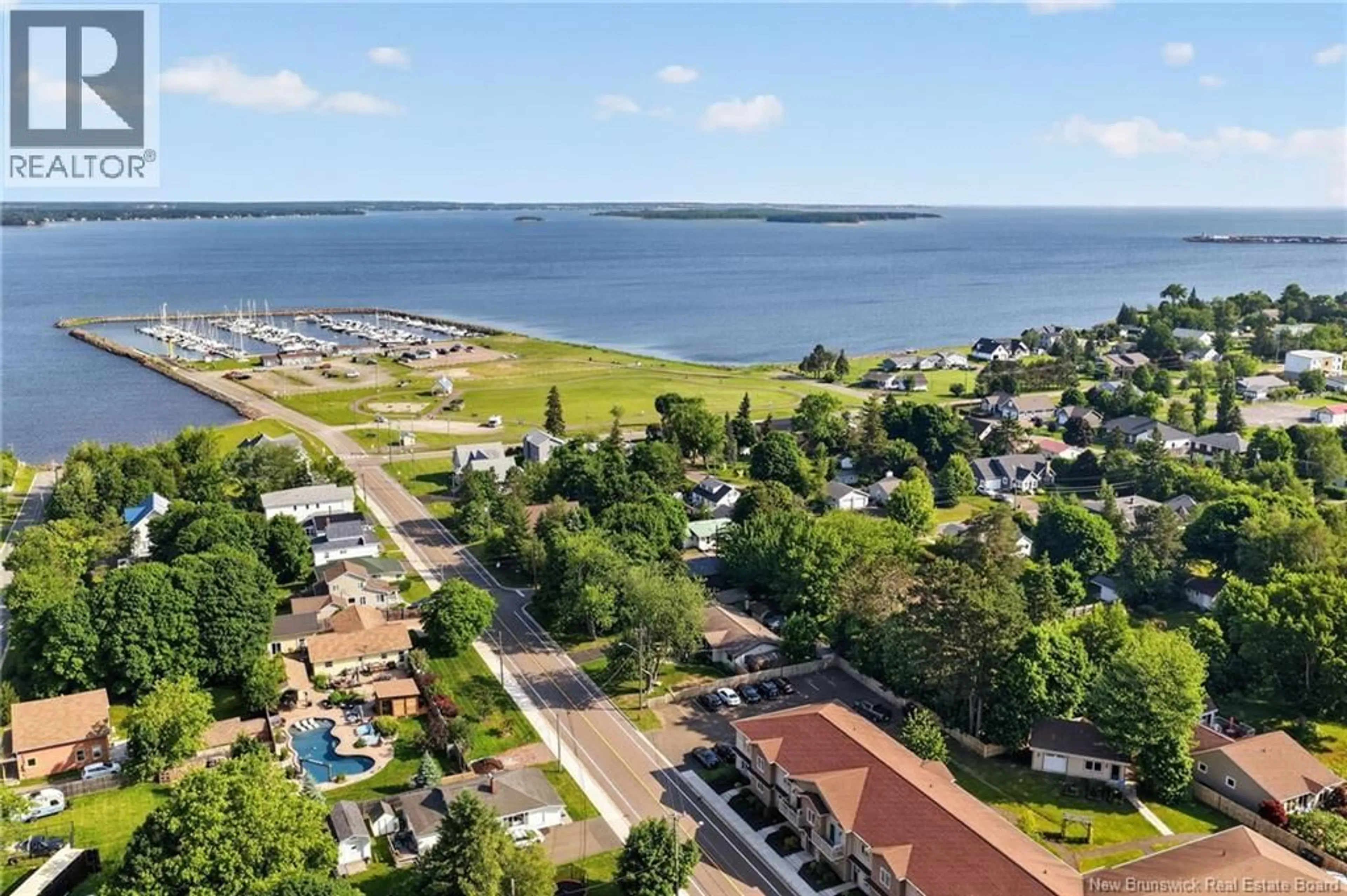 A pic from outside/outdoor area/front of a property/back of a property/a pic from drone, water/lake/river/ocean view for 201 - 98 PLEASANT STREET, Shediac New Brunswick E4P2L6