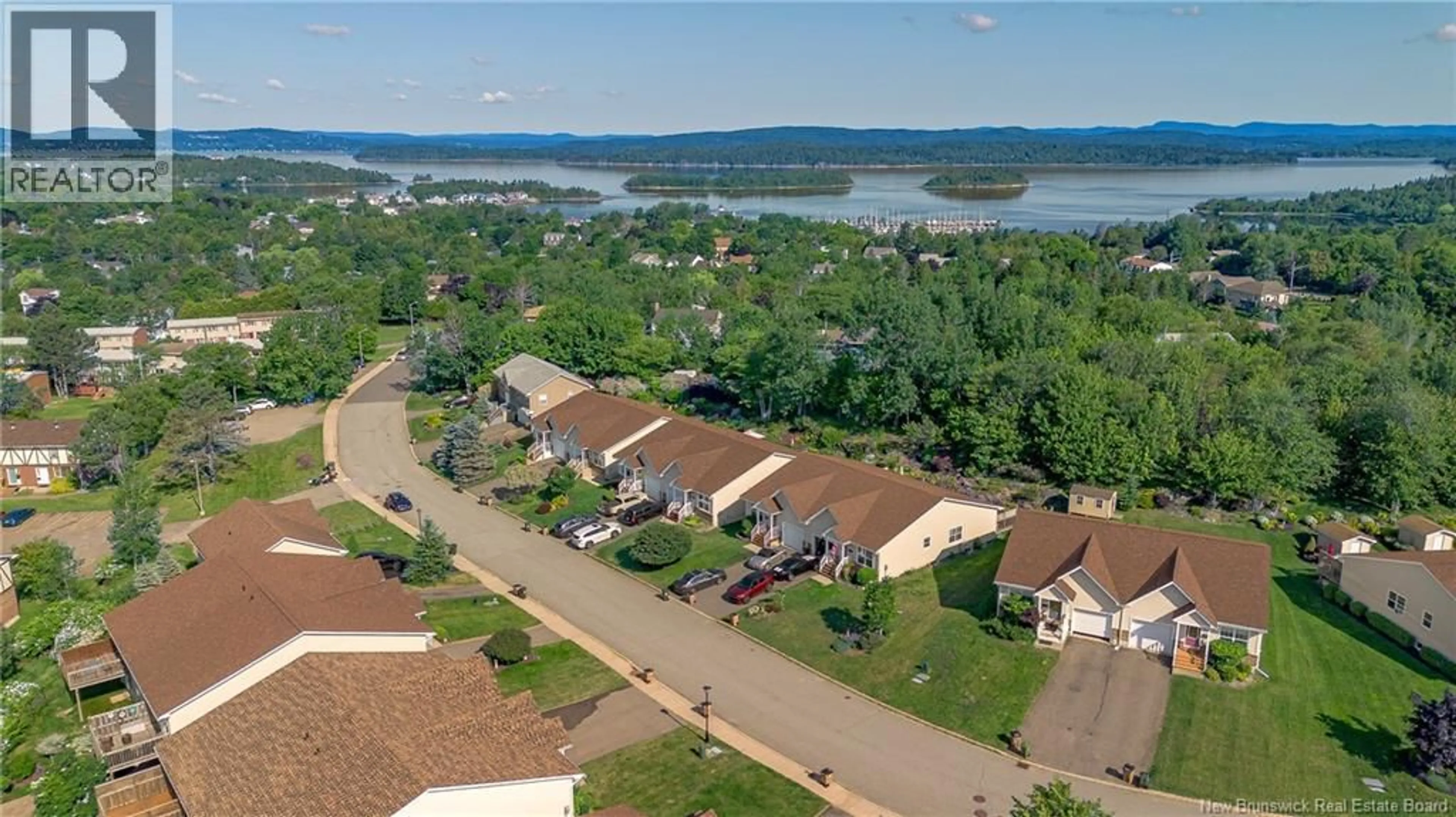 A pic from outside/outdoor area/front of a property/back of a property/a pic from drone, water/lake/river/ocean view for 59 TUDOR LANE, Saint John New Brunswick E2K5T7