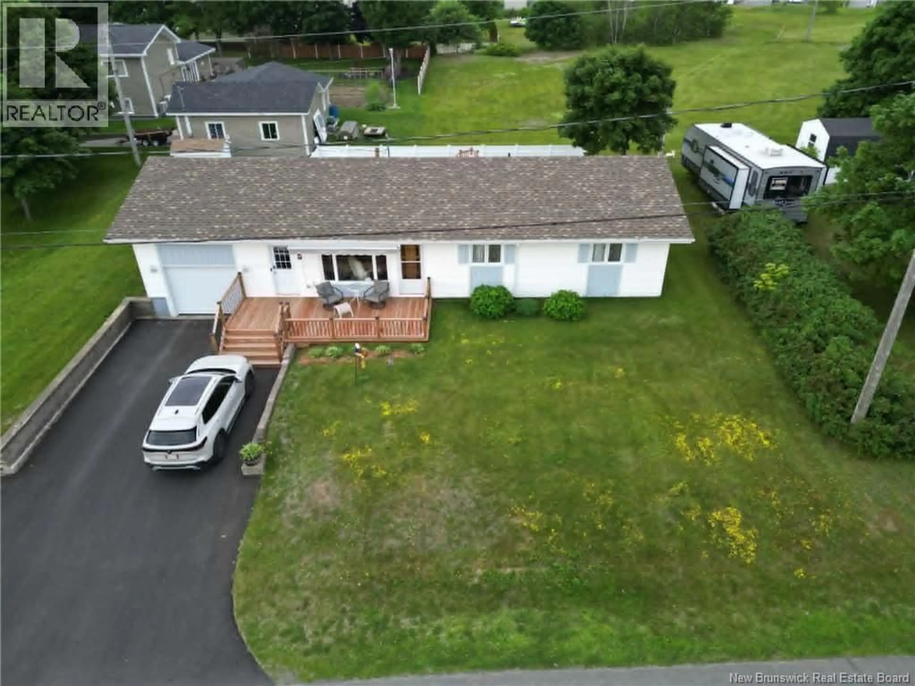 A pic from outside/outdoor area/front of a property/back of a property/a pic from drone, street for 16 DES PATRIOTES, Caraquet New Brunswick E1W1B6