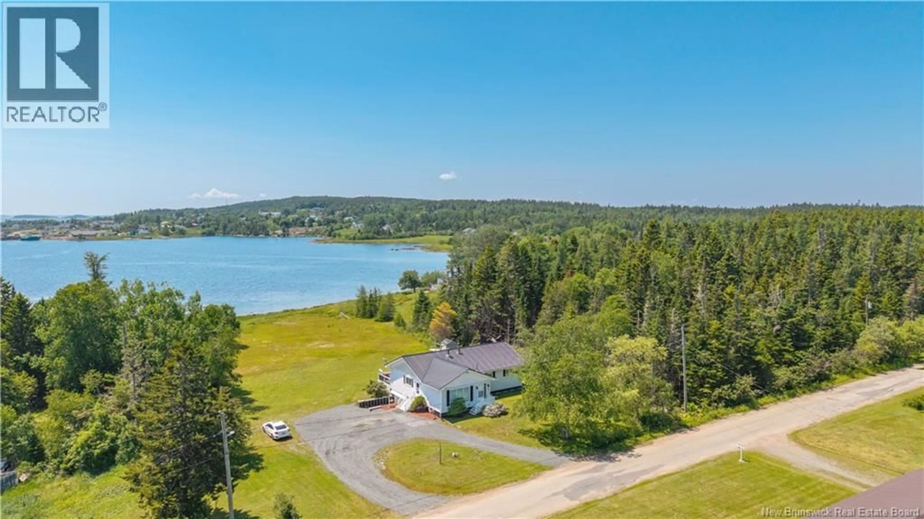 A pic from outside/outdoor area/front of a property/back of a property/a pic from drone, water/lake/river/ocean view for 34 LEAVITT HEAD ROAD, Back Bay New Brunswick E5C1Z7