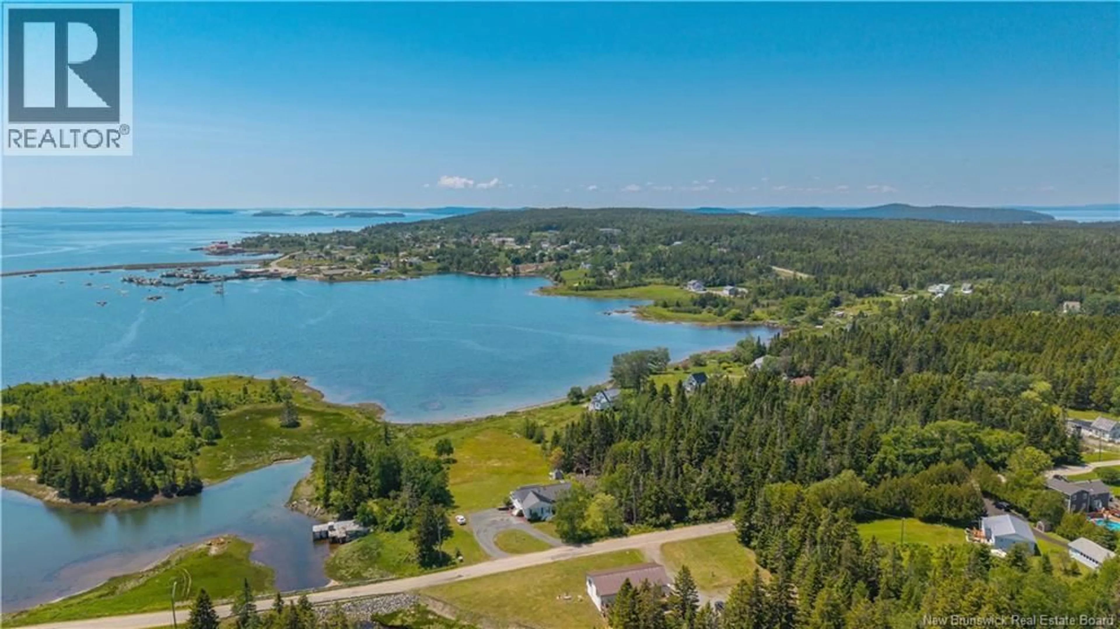 A pic from outside/outdoor area/front of a property/back of a property/a pic from drone, water/lake/river/ocean view for 34 LEAVITT HEAD ROAD, Back Bay New Brunswick E5C1Z7