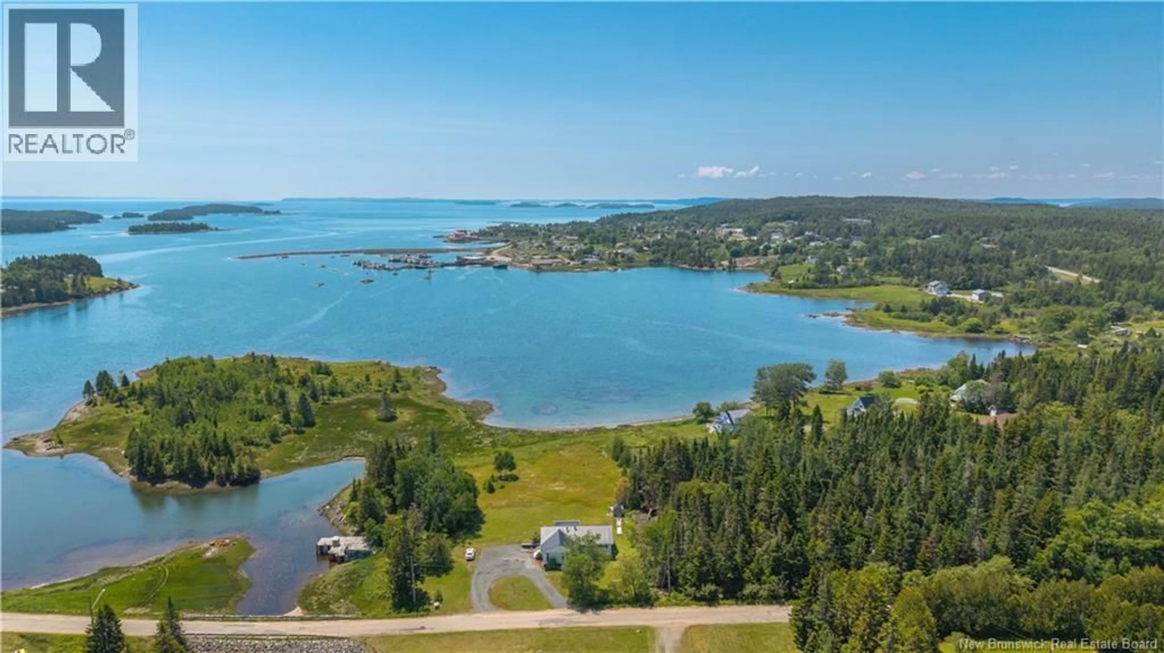 A pic from outside/outdoor area/front of a property/back of a property/a pic from drone, water/lake/river/ocean view for 34 LEAVITT HEAD ROAD, Back Bay New Brunswick E5C1Z7