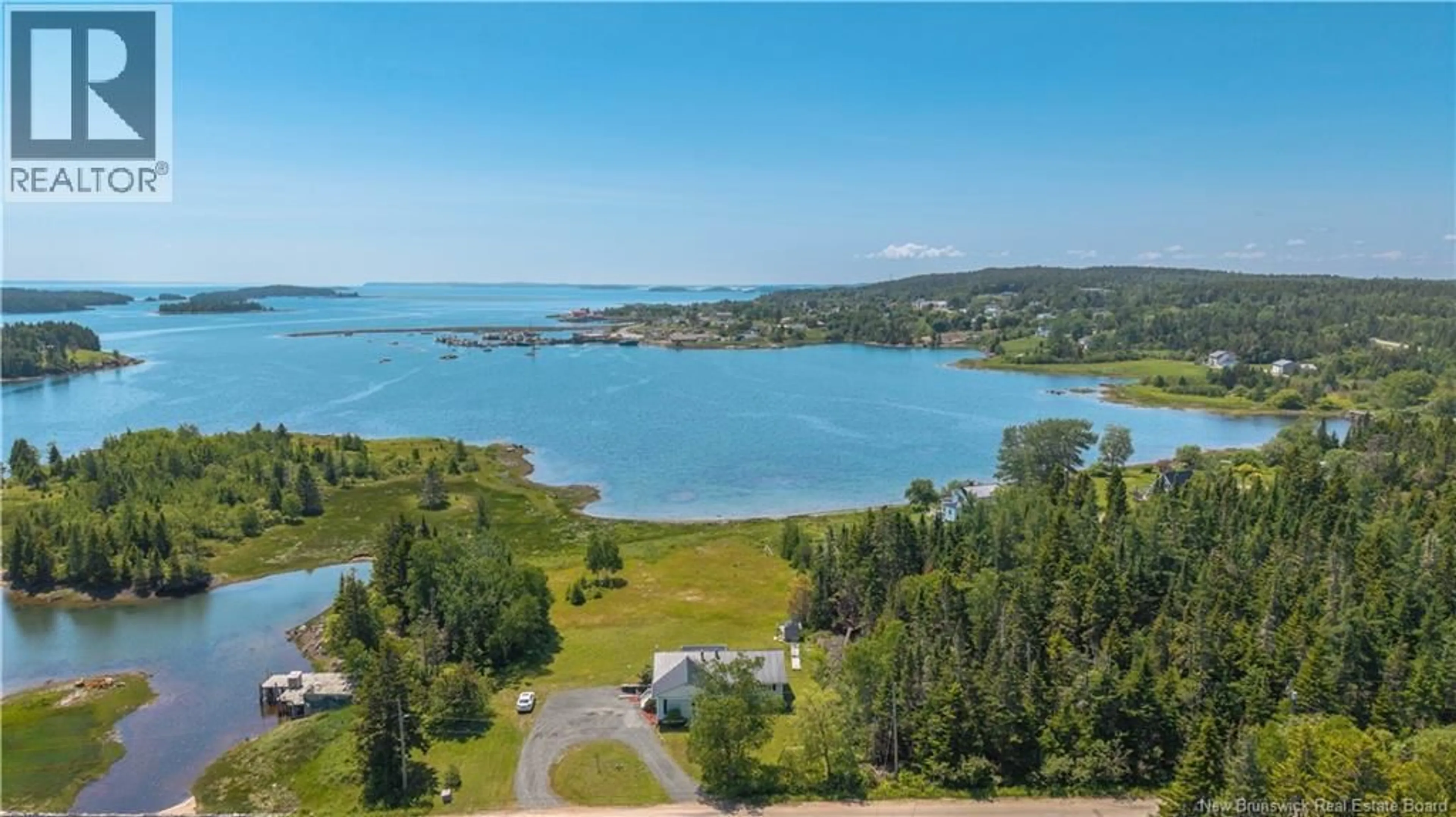 A pic from outside/outdoor area/front of a property/back of a property/a pic from drone, water/lake/river/ocean view for 34 LEAVITT HEAD ROAD, Back Bay New Brunswick E5C1Z7