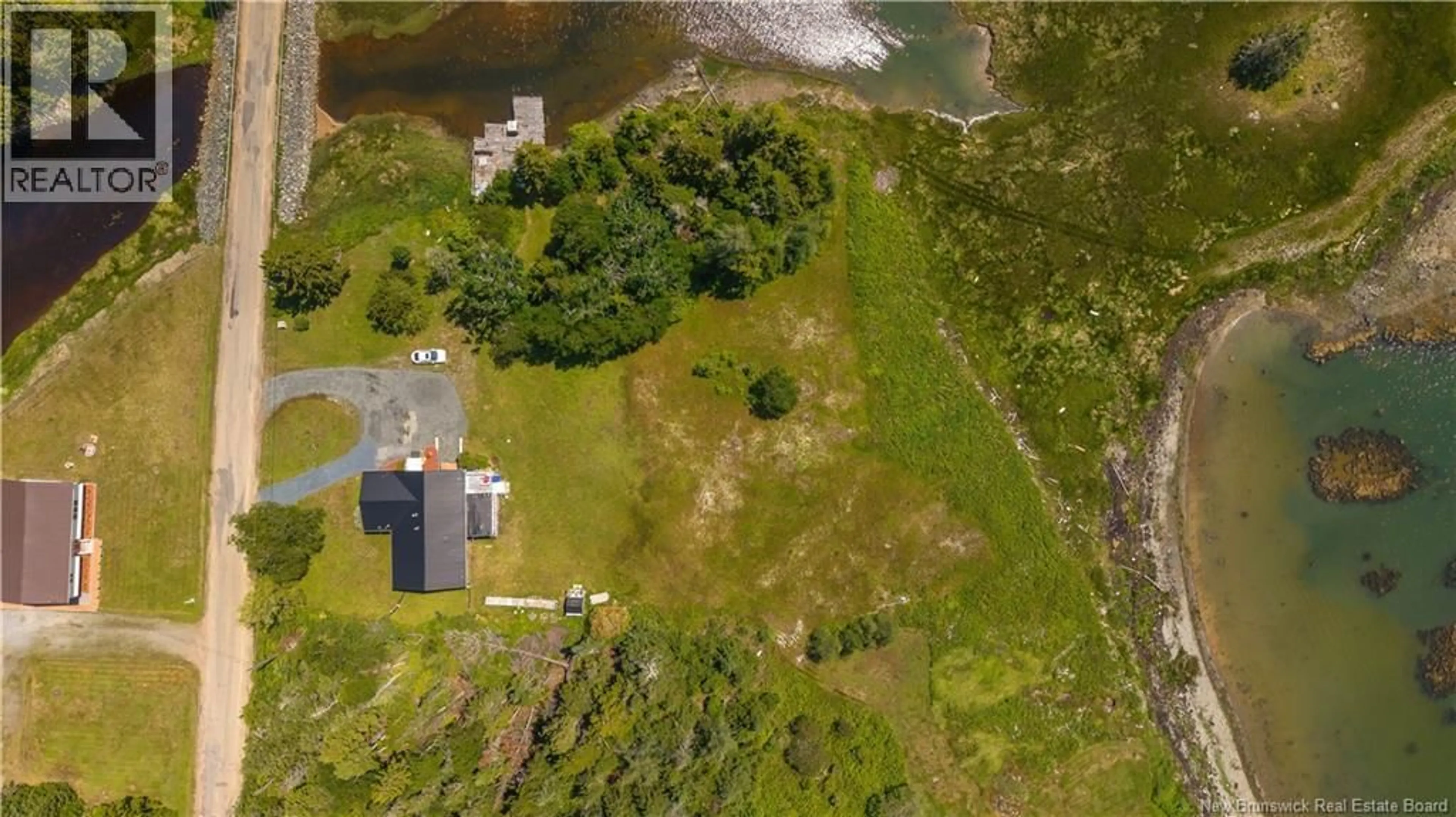 A pic from outside/outdoor area/front of a property/back of a property/a pic from drone, water/lake/river/ocean view for 34 LEAVITT HEAD ROAD, Back Bay New Brunswick E5C1Z7