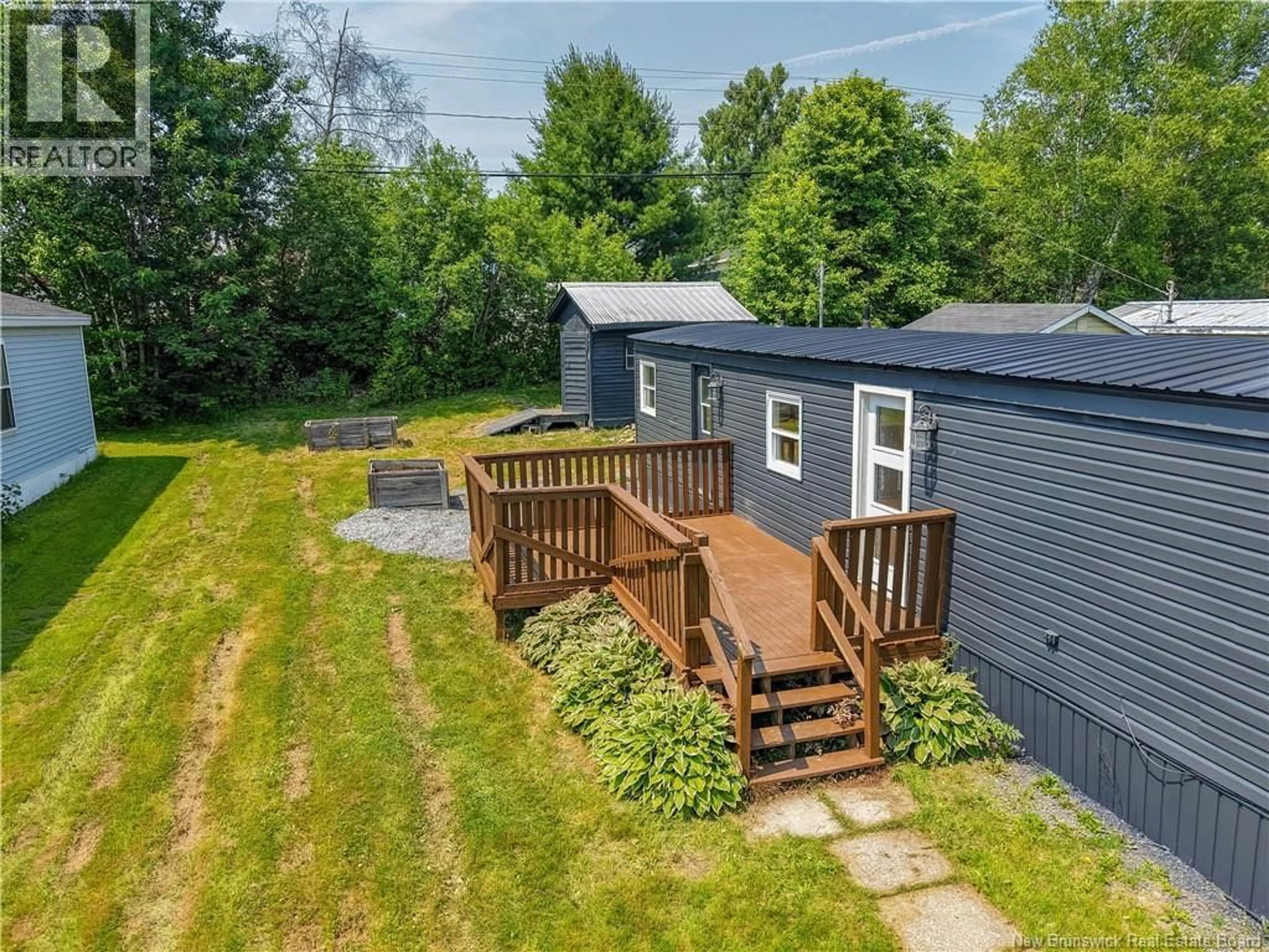 A pic from outside/outdoor area/front of a property/back of a property/a pic from drone, unknown for 62 HEDGEVIEW DRIVE, Hanwell New Brunswick E3B6S2