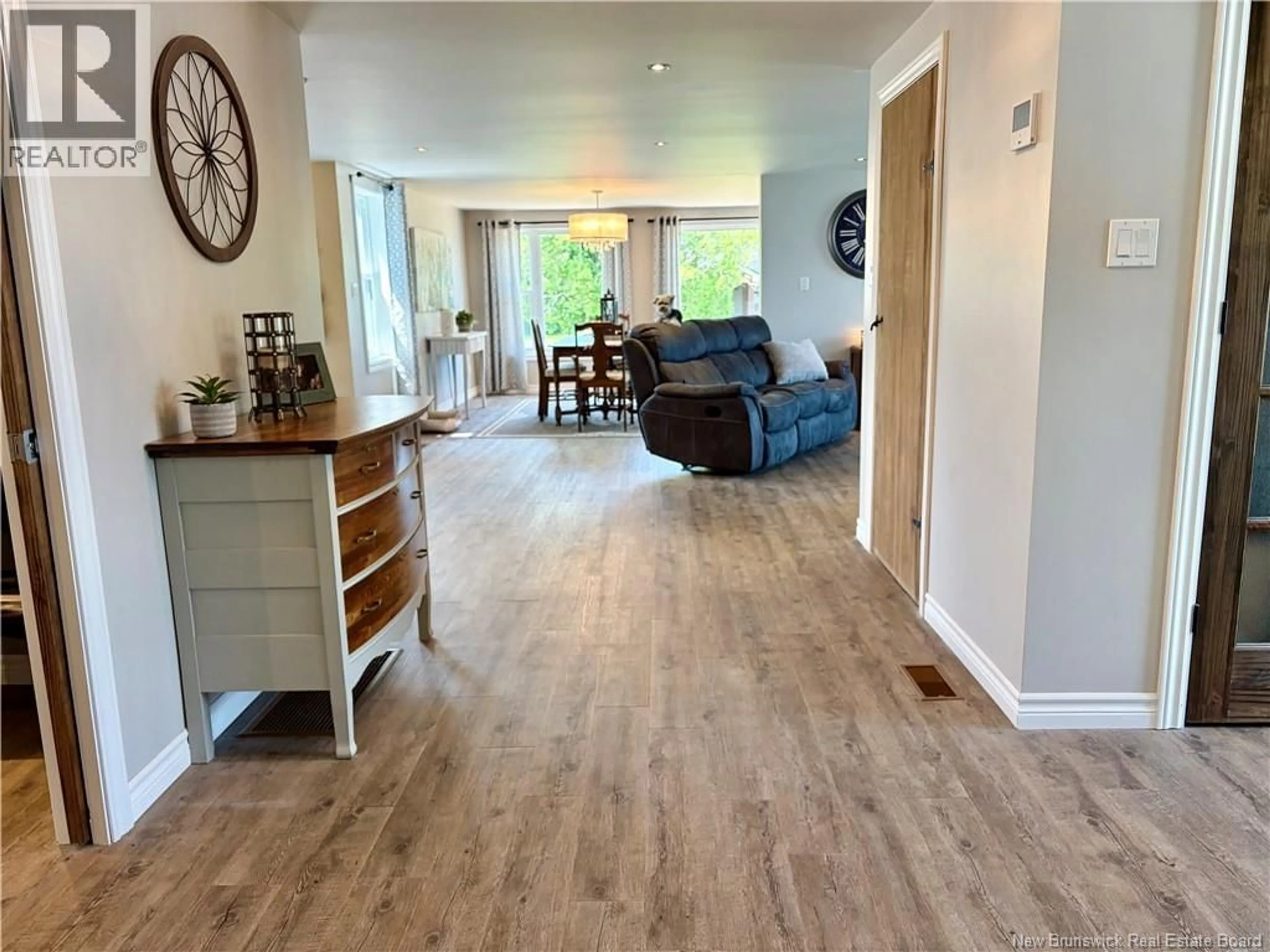 Living room with furniture, wood/laminate floor for 198 CHALEUR, Charlo New Brunswick E8E2E8