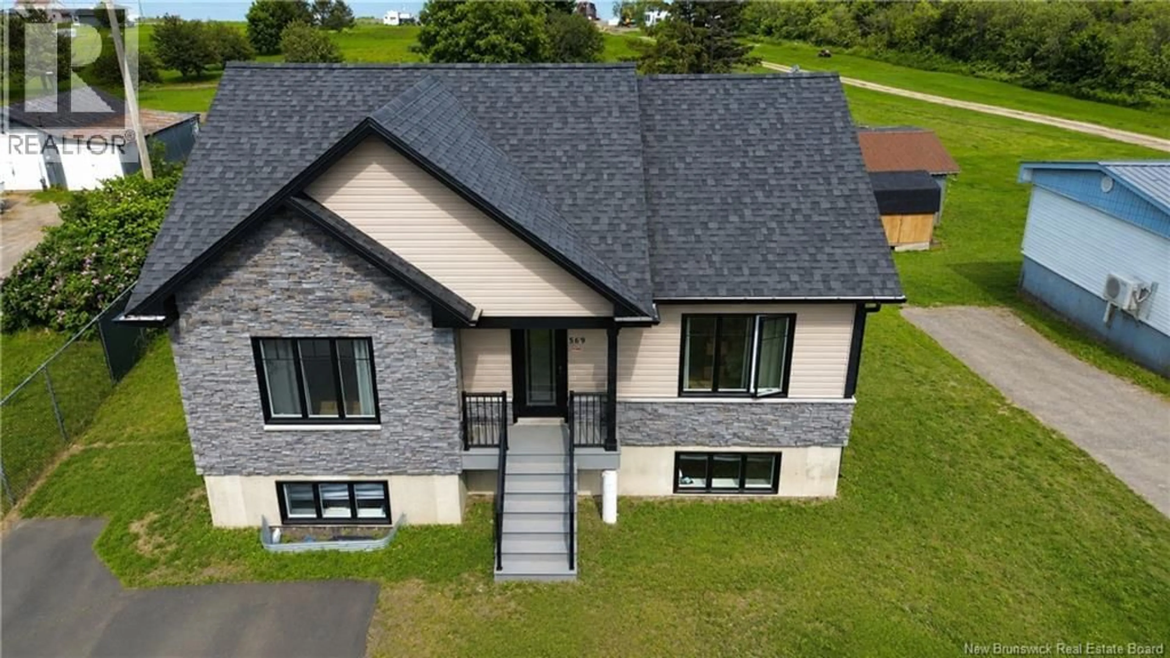 A pic from outside/outdoor area/front of a property/back of a property/a pic from drone, building for 569 RUE PRINCIPALE, Beresford New Brunswick E8K1X6