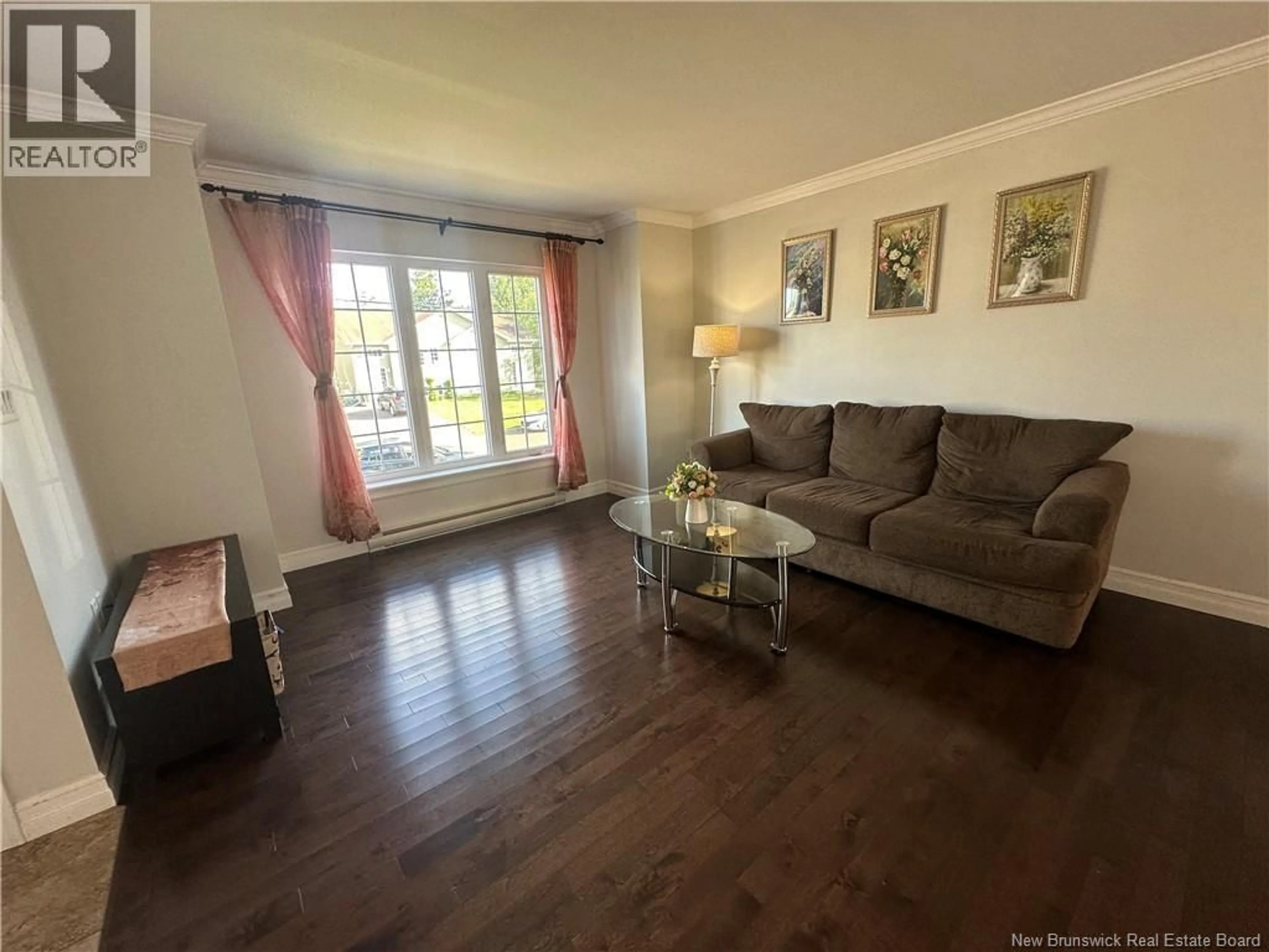 Living room with furniture, wood/laminate floor for 91 HOLLAND DRIVE, Moncton New Brunswick E1G0X5