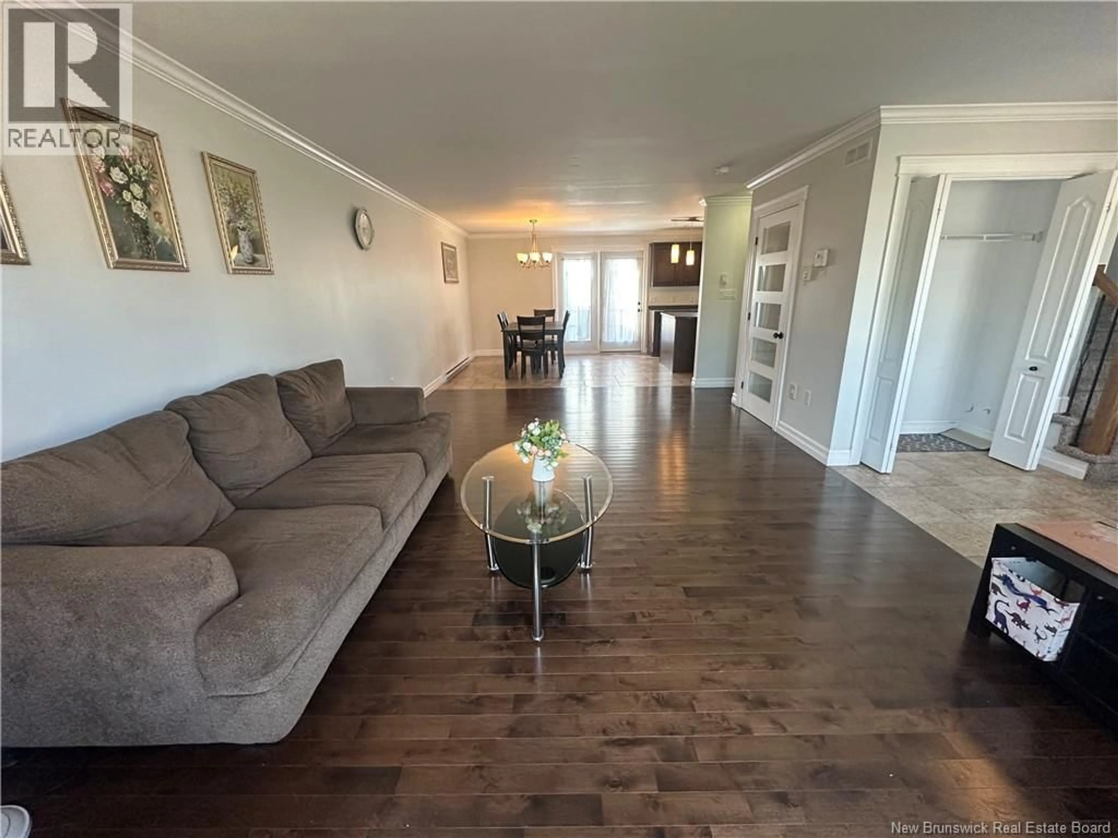 Living room with furniture, wood/laminate floor for 91 HOLLAND DRIVE, Moncton New Brunswick E1G0X5