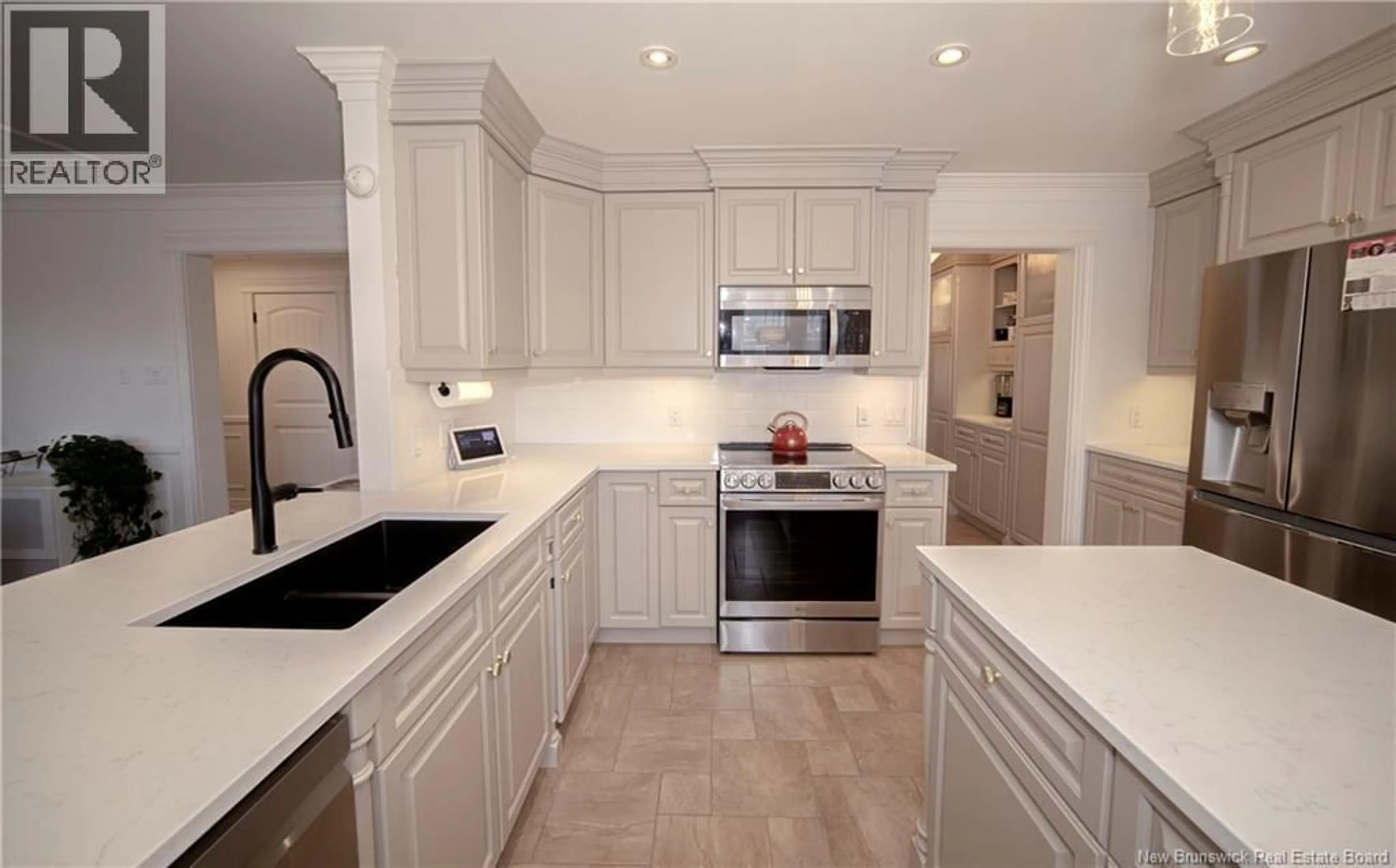 Open concept kitchen, ceramic/tile floor for 10 EMMA COURT, Fredericton New Brunswick E3G0W2