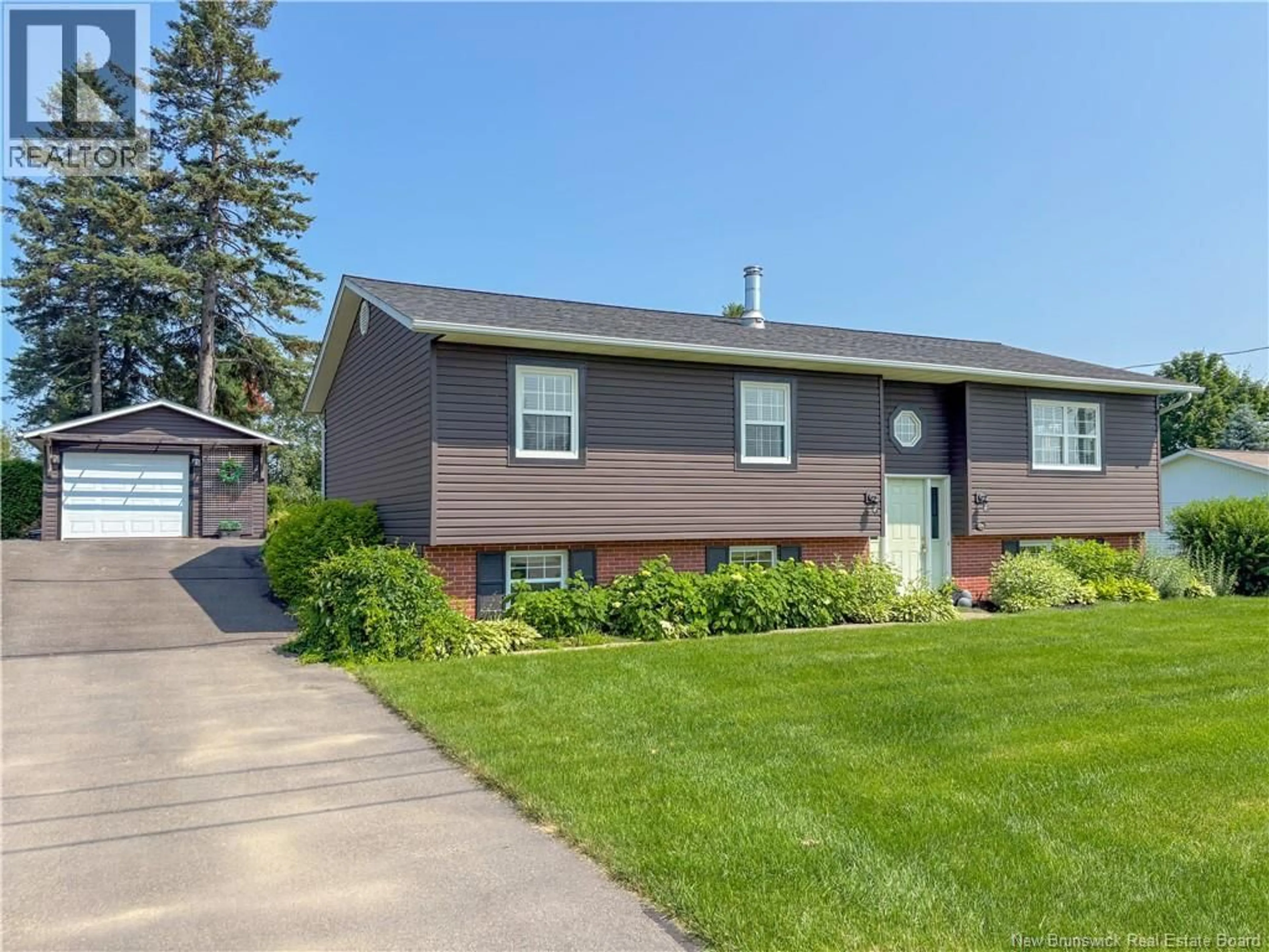 Home with vinyl exterior material, street for 106 BICENTENNIAL DRIVE, Woodstock New Brunswick E7M6A7