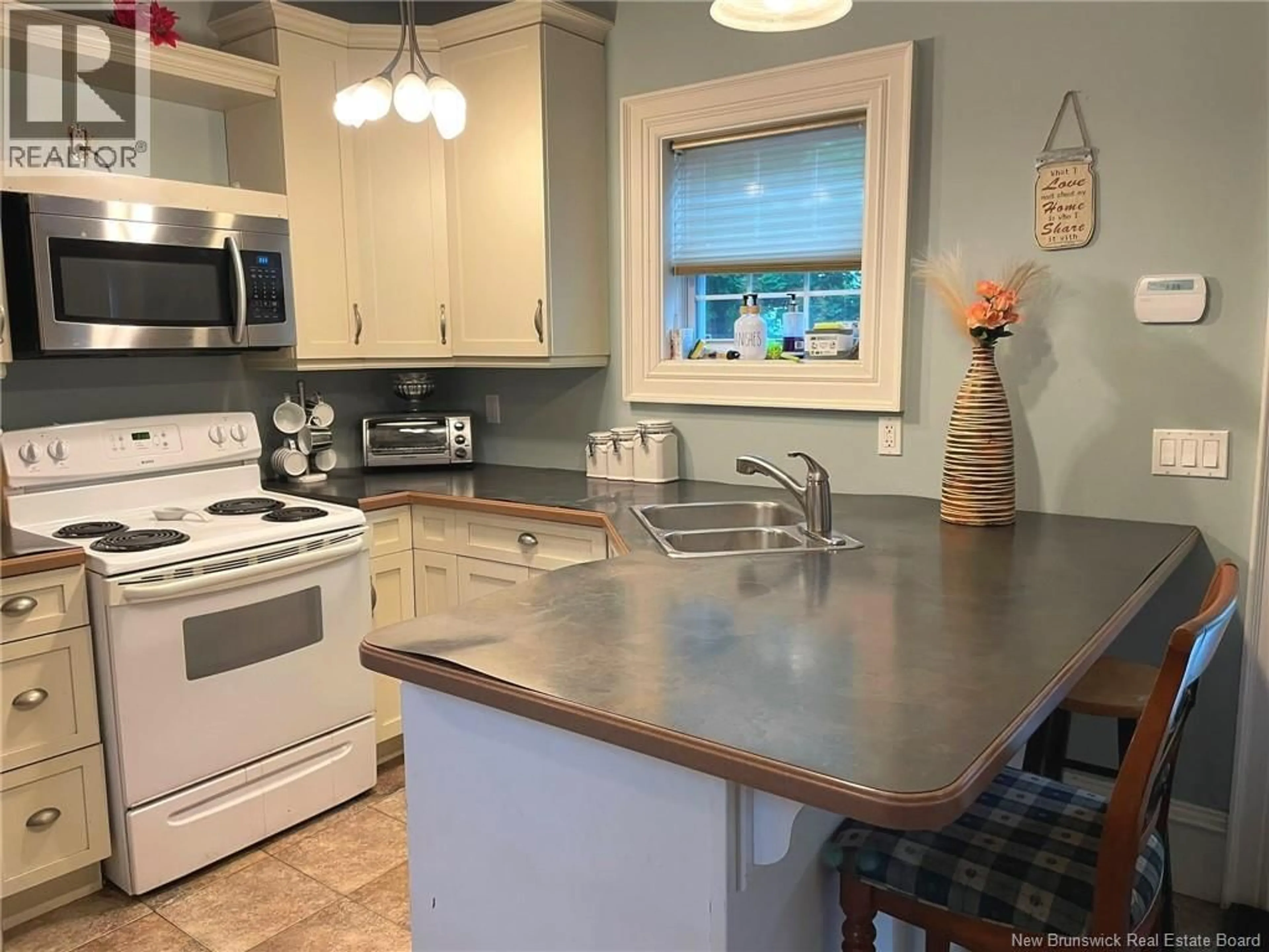 Open concept kitchen, ceramic/tile floor for 105 GORDON STREET, Moncton New Brunswick E1C1M5