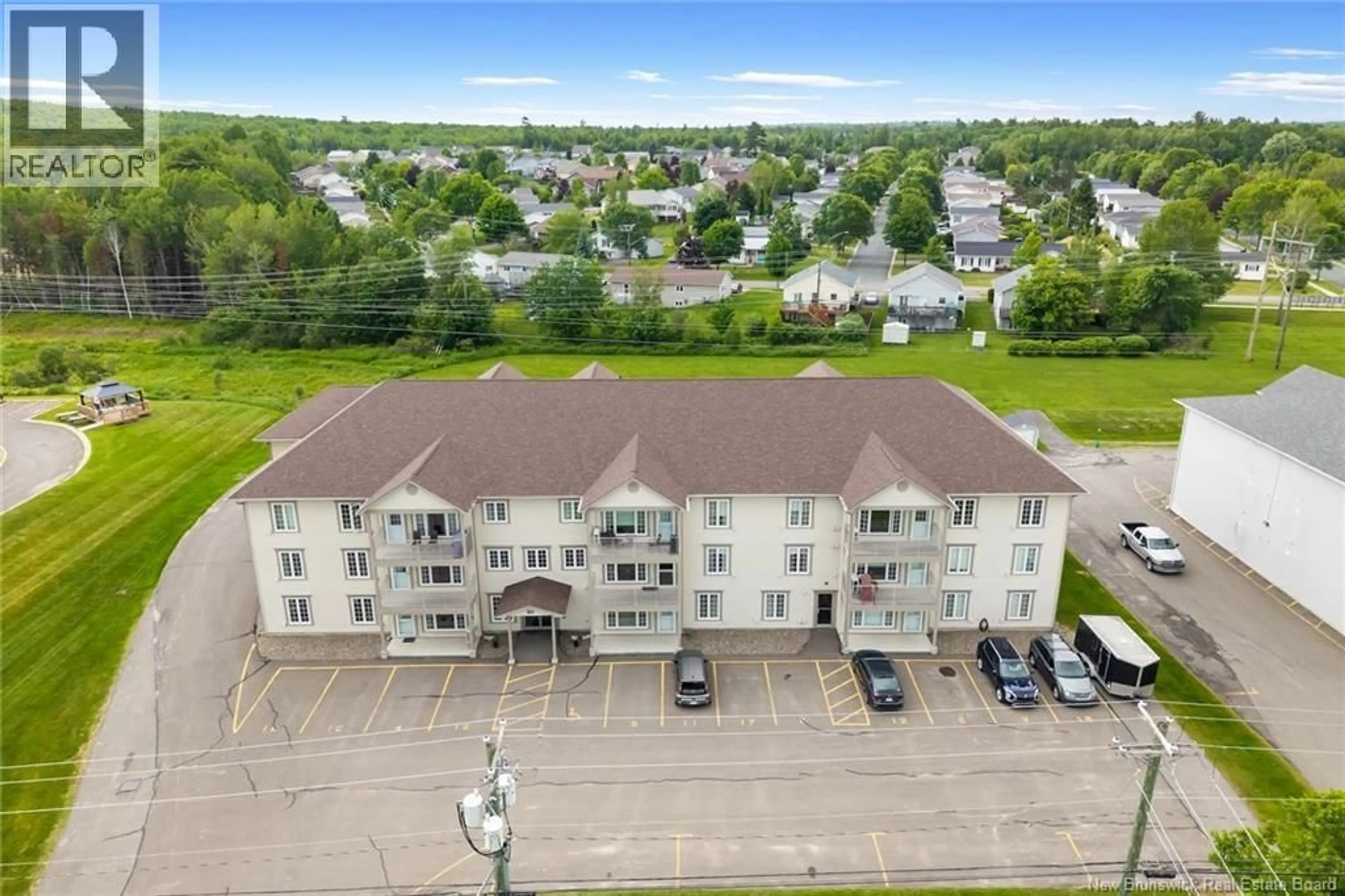A pic from outside/outdoor area/front of a property/back of a property/a pic from drone, unknown for 318 - 195 REYNOLDS STREET, Fredericton New Brunswick E3A0S5
