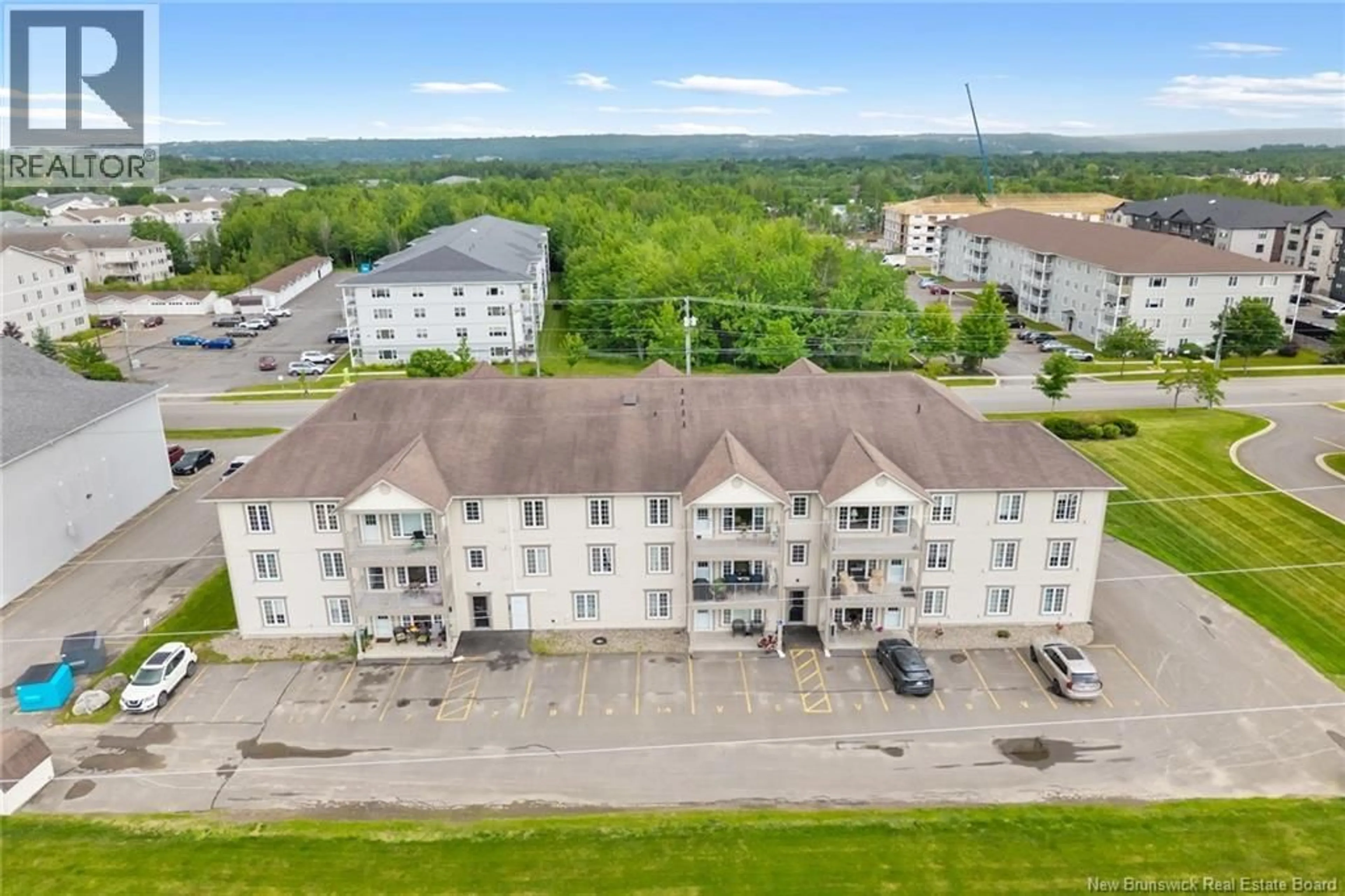 A pic from outside/outdoor area/front of a property/back of a property/a pic from drone, building for 318 - 195 REYNOLDS STREET, Fredericton New Brunswick E3A0S5